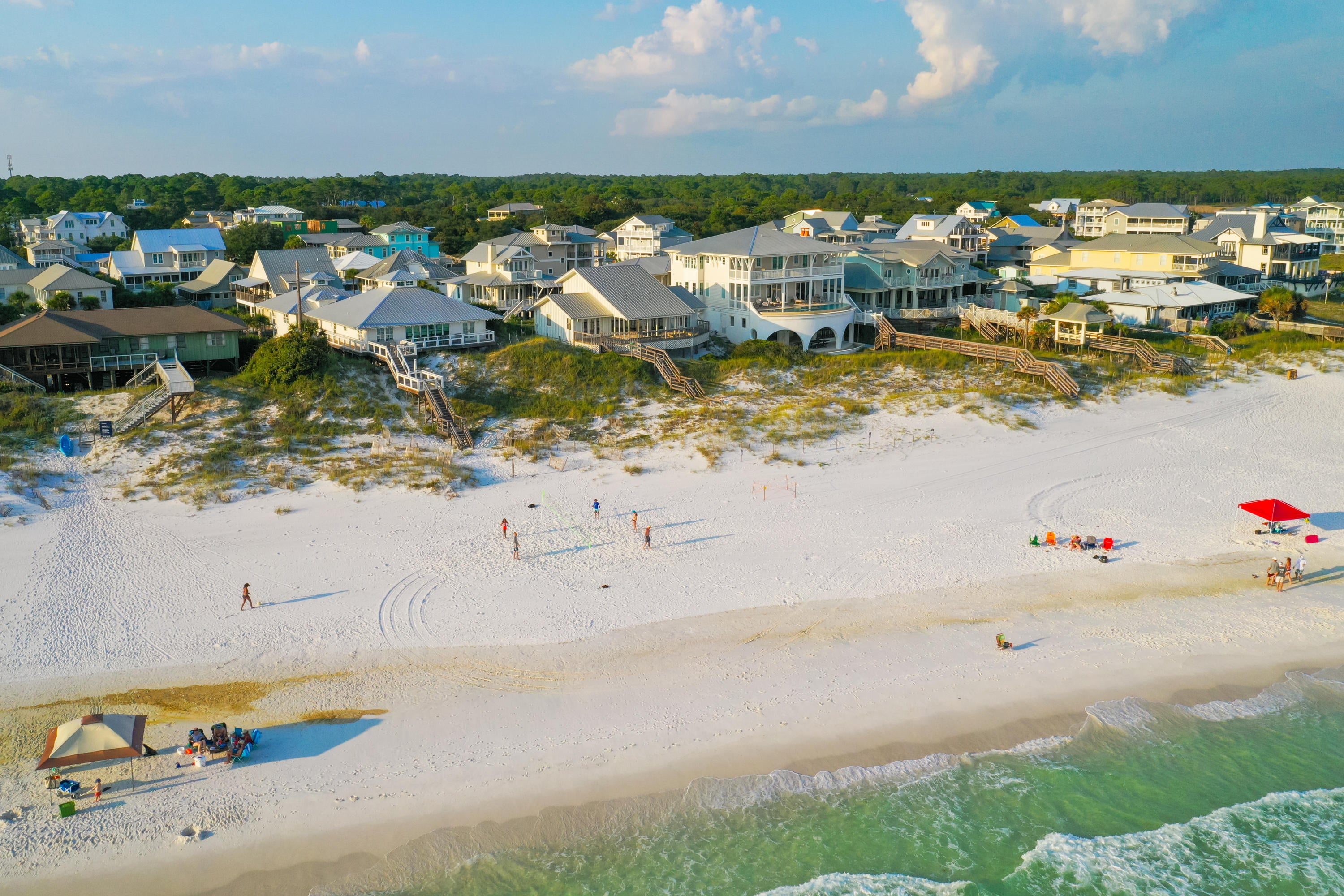 Perched upon a picturesque dune top in enchanting Grayton Beach, this Gulf-front parcel offers a unique opportunity for both those longing for a classically coastal ownership experience, as well as those searching for an ideal canvas to construct their dream beach retreat.
Wake up to views overlooking 75 private feet of Gulf frontage made all the more spectacular thanks to the hilltop locale of this homesite. 400 feet of lot depth provides a remarkably private surround, with opportunity for a multi-dwelling project, rarely found along west Scenic Highway 30A.
Direct access to the sugar white sand beaches is merely footsteps away, with natural vegetation flourishing throughout the property. The current dwelling is a true late mid-century Formalist design, offering plentiful paneled glass surrounds and open living spaces, idyllic of coastal retreats of the era. Low slung ceiling lines offer a modernist flair, while Floridian accents such as tongue and groove paneling adorning walls, a lofted bedroom space provides unfaltering views, and a covered deck offers world-class views morning, afternoon, or sunset. 

A rare find among 30A, this neo-modernist homestead provides adequate space for renovation, additions, and new construction opportunities, if desired. A fresh design on the property could elicit countless options for custom retreats. Property is being sold "As-Is"