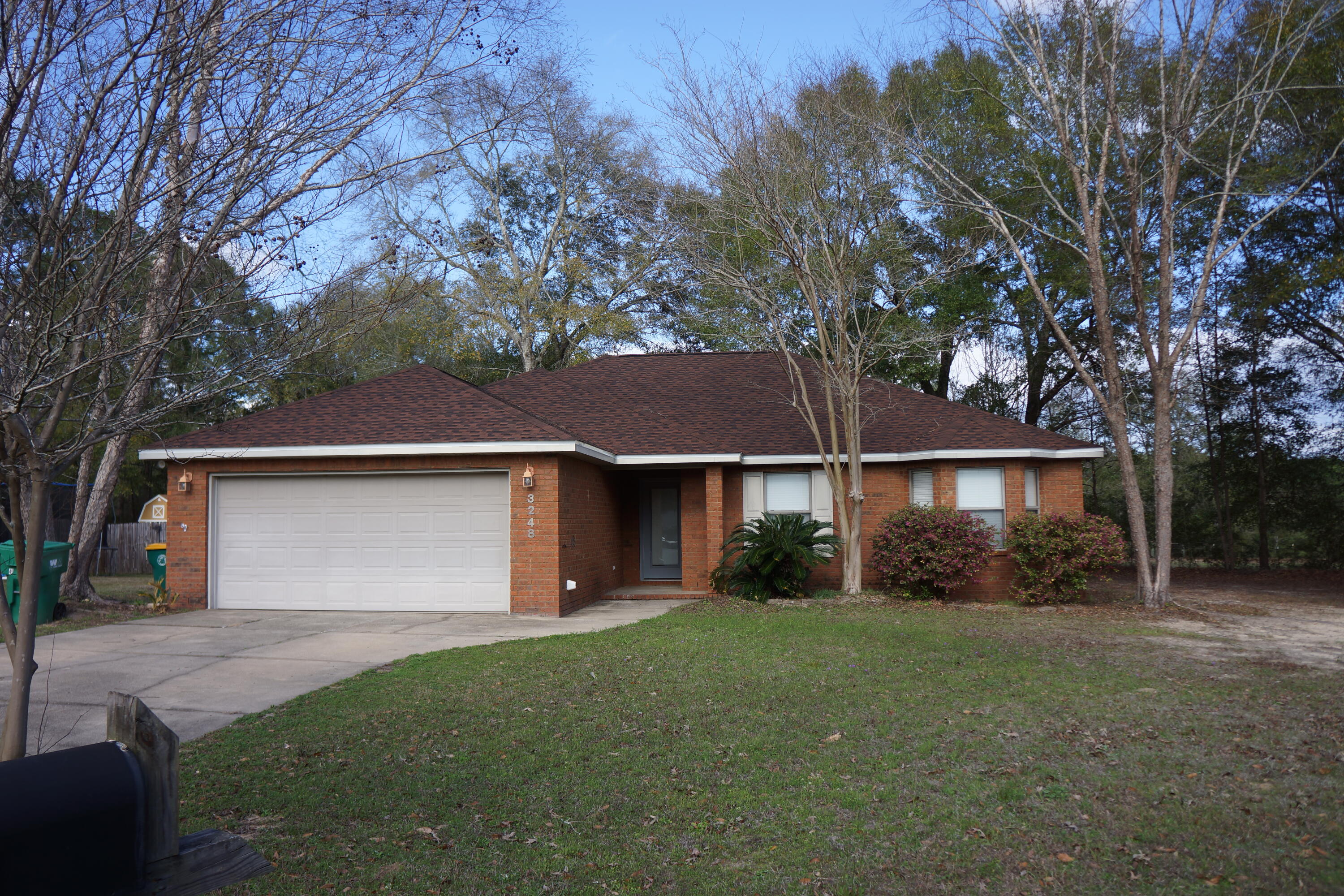 All-brick home in a quiet subdivision with no HOA. This split floor plan features 4 bedrooms, 2 baths, and a spacious living room with a raised ceiling. The kitchen offers stainless steel appliances, wood cabinets, ample counter space and storage, plus a lighted walk-in pantry. The primary suite includes a large bedroom with tray ceiling, an ensuite bath with a double vanity, garden tub, separate shower, and walk-in closet. The three additional bedrooms are generously sized, each with tray ceilings, and one features a charming bay window. French doors in both the living room and primary bedroom open to a deck and backyard. Updates include a new roof in 2025, AC in 2019, and a new built-in microwave. Selling AS-IS. Seller is offering a home warranty and $5,000 in any-way money.