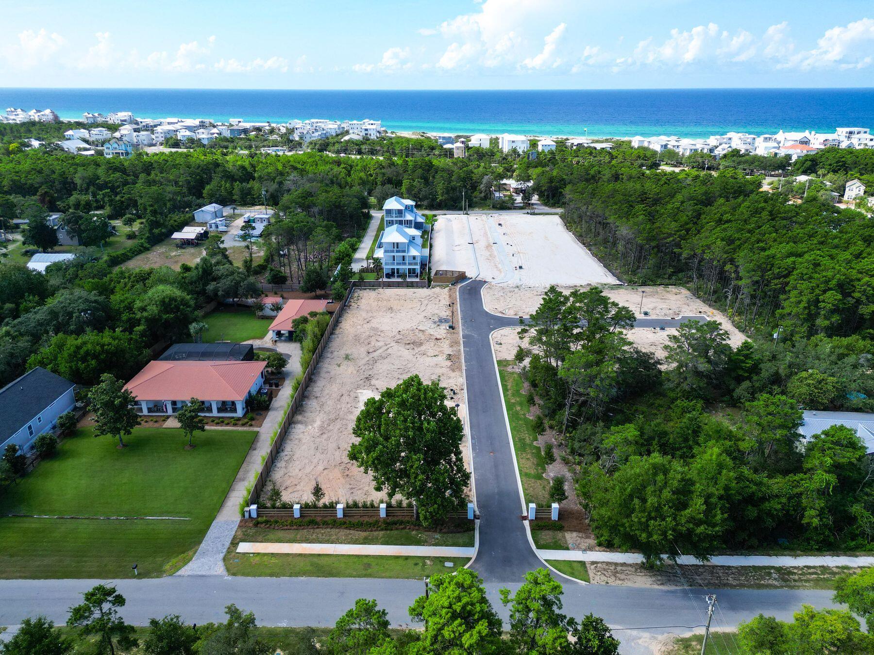 Development Order in hand, this 12-lot subdivision in Walton County is a fantastic opportunity for builders and developers looking for a ready-to-go project near Florida's sought-after Emerald Coast. With tap fees paid and all utilities—water, electric, and gas—installed at each lot, this property is fully prepared for vertical construction, saving time and upfront costs.
The subdivision features twelve spacious lots, six of which offer potential water views, providing added appeal for future resale or custom home builds. Infrastructure is complete, including finished community roads and a professionally landscaped and landscaped entrance that enhances the overall curb appeal. Perfectly positioned just minutes from public beach access and the natural beauty of Camp Helen State Park, this location offers both tranquility and convenience. Whether you're envisioning a private, gated enclave or planning to sell the lots individually for profit, this development delivers exceptional value. Opportunities like this don't come along oftendon't miss your chance to secure a prime piece of coastal Florida real estate with everything in place to begin building.