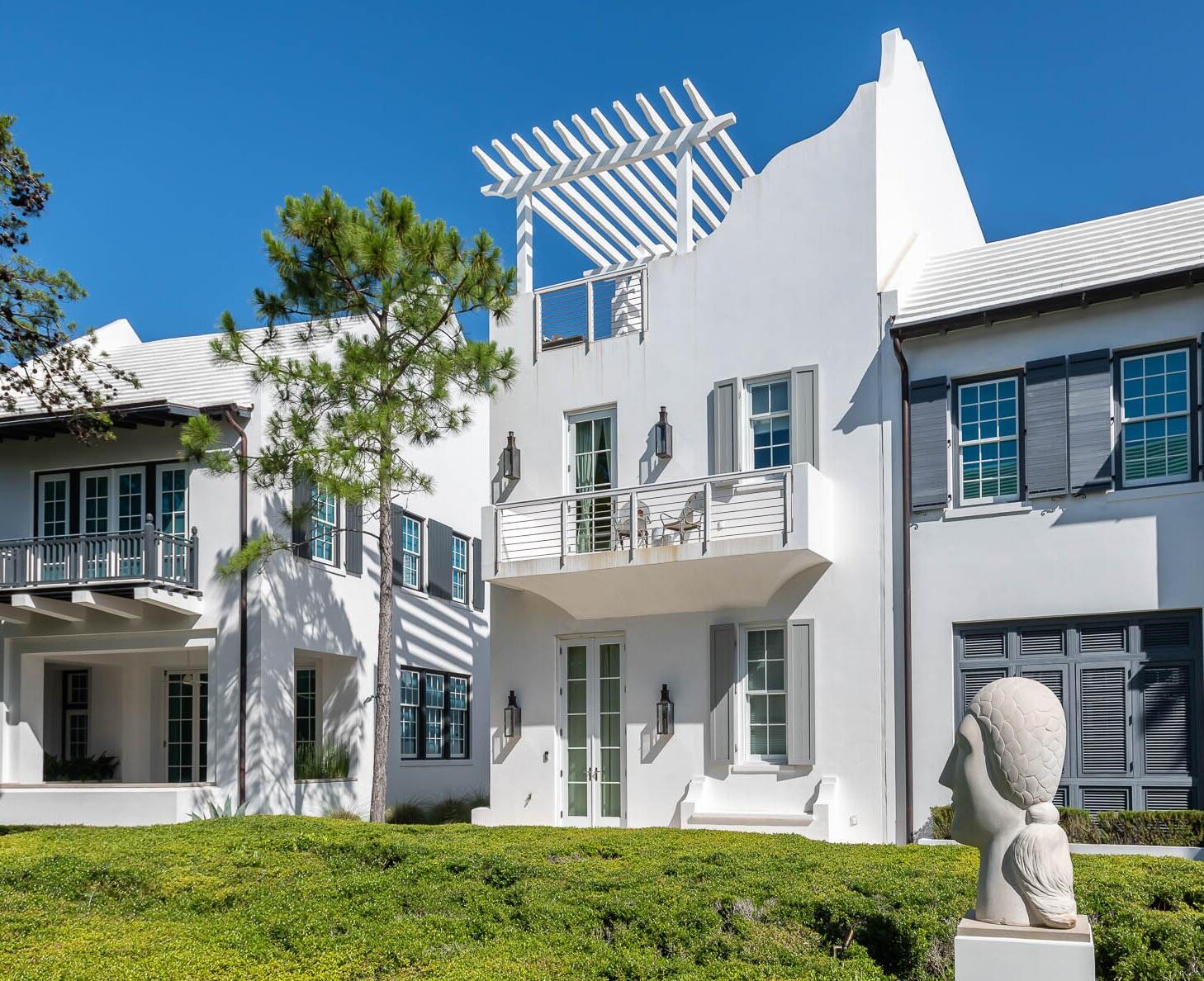 60 Spice Berry delivers modern living amongst the peaceful setting of Arboleda Park in Alys Beach. This highly desired location is set amongst the Alys Beach Town Center, Caliza Pool & Restaurant, the Nature Preserve and the Zuma Wellness Center.
A south facing courtyard opens to a pedestrian path which maximizes natural light into the open kitchen, living and dining area. 12 foot ceilings and a bi-folding door system embrace the private courtyard and plunge pool. 4 bedrooms are thoughtfully placed throughout A Boheme's design. A first floor guest bedroom overlooks Arboleda Park while two Master Bedrooms anchor the second floor. A third floor den serves as additional sleeping space and a great separate hangout area for kids. The third floor also offers a wet bar and rooftop terrace that looks south over Arboleda Park. Above the two car garage is a detached carriage house that provides a private bedroom with its own kitchen and living area.