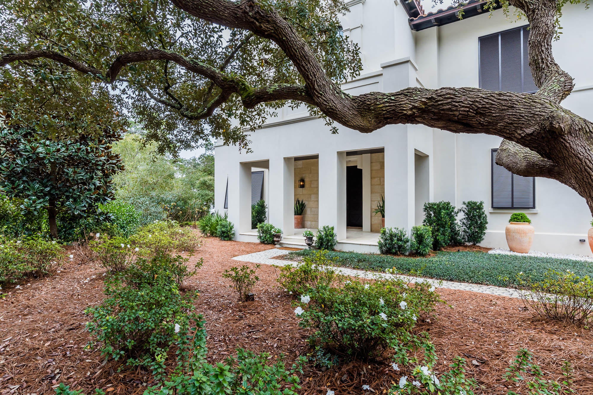 This exceptional home is set among a cluster of Sand Oaks in the private and tranquil gated lakefront community of Redfish Lane. This community offers a deeded beach access and is rental restricted. The towering mahogany door opens to unveil an interior and exterior oasis. You will feel welcomed by the spacious entry as your eyes move forward through the cozy loggia featuring a summer kitchen, fireplace and spacious living/dining area with a retractable screen. Look further and be drawn to the pool, fountain and courtyard framed perfectly by the beautiful oak trees and various areas to lounge and entertain.The entry level of the home also offers 4 spacious bedrooms each with a private bath plus an additional powder room. A two car garage complete with a sand room and extra storage. An elevator services all levels. The gracious staircase leads to the library with its built in bookshelves and large arched windows. The second level offers a sprawling open concept design flooded with natural light. The living area is a comfortable space with a grand fireplace and trayed ceiling and large windows affording expansive views of the pool and courtyard.The dining area is open and provides room for an oversized table. Enjoy the open chef's kitchen with its luxury appliances and abundance of countertop space complete and a large pantry. The perfect setting for entertaining. Beyond the breakfast area you will step onto a spectacular treetop screen porch for dining and relaxing complete with a fireplace and stairs leading to the pool. The master suite ,also located on this level, provides a serene view to the pool and courtyard. The master bath boasts a spa-like retreat with its massage tub, steam shower and an expansive walk-in closet.
Seller is a licensed real estate broker.