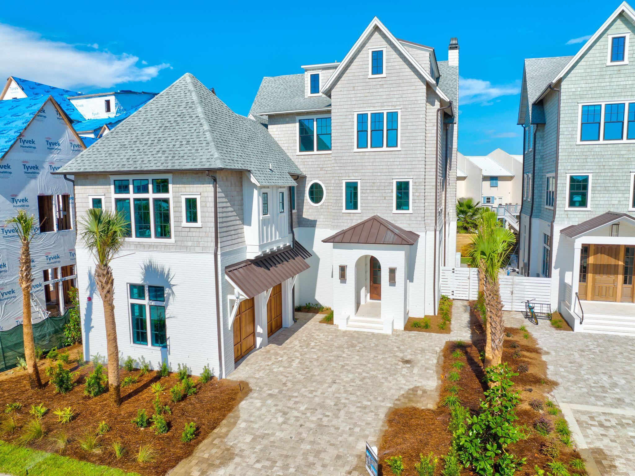 Introducing Grand Inlet, the newest exclusive low-density community opportunity in Inlet Beach featuring a unique collaboration with the Development team at Freeman Partners, the Builders at Holiday Beach Development, and the Magnolia House Design Group team. 

The four home community has been thoughtfully designed by the sought after team at T.S. Adams Studio keeping architectural integrity in mind while taking full advantage of the prime location and stunning Gulf views. 37 Grand Inlet Court is situated on an interior homesite boasting over 6,200 square feet of well planned living and entertaining space. The first floor features an oversized media room in addition to two bedrooms with en-suites and access to the outdoor oasis. The custom saltwater pool trimmed with Medusa pavers is an icon of relaxation. Upon entering the second floor, which can be accessed by the elevator servicing all four floors of the home, your eyes will be drawn to the custom wood ceiling adornments and random width white oak flooring. 

The kitchen is a chefs dream with a Sub Zero and Wolf appliance suite along with ample storage space and Quartzite waterfall. The distinction between indoors and out is blurred with the oversized sliding glass doors which create a seamless divide between the living room and covered porch areas. 

The third level is home to the primary suite complete with a private sitting area, covered porch, and large walk-in closet. Fun awaits on the sun deck on the fourth floor which is the perfect place to enjoy the vibrant coastal sunsets. The upmost quality of finishes and fixtures have been selected throughout the home with no detail overlooked. 

The residence is being offered fully furnished creating a truly compelling opportunity for investors and full-time residents alike. Inquire today to coordinate a private viewing and start living the coastal lifestyle you deserve. 

Notable features include gas entry lanterns, eight-foot solid core doors, impact guard rated windows, smart home technology, whole-home audio wiring, forty-year architectural shingles, and an attached two-car garage.