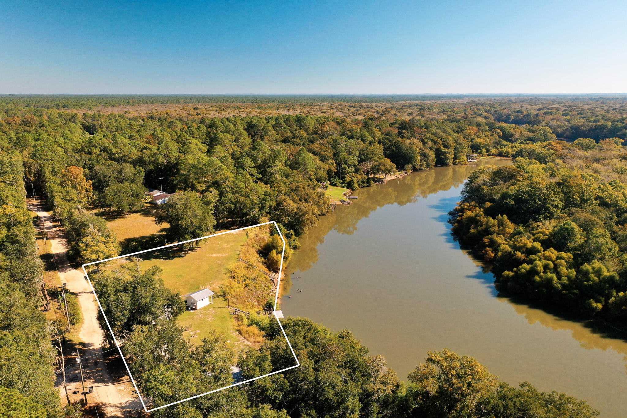 Welcome to 117 Reddick Loop in Ponce de Leon, Florida, a peaceful slice of land surrounded by mature oaks and natural beauty. Set on nearly 0.67 acres, this property offers privacy and potential in one of Northwest Florida's quietest corners.

Positioned on a secluded loop with gentle elevation above the nearby river valley, the setting feels calm and open, with just enough space to create something meaningful. With well, septic, and power connections already in place, the groundwork is ready for a new owner to build or place a home without the typical hurdles of undeveloped land.

The area is known for its untouched landscapes, freshwater springs, and easy access to outdoor recreation while remaining within reach of nearby towns and the beaches of South Walton. Whether you're planning a permanent home, a weekend retreat, or a simple investment, 117 Reddick Loop offers the kind of natural setting that's increasingly hard to find; quiet, authentic, and ready to make your own.