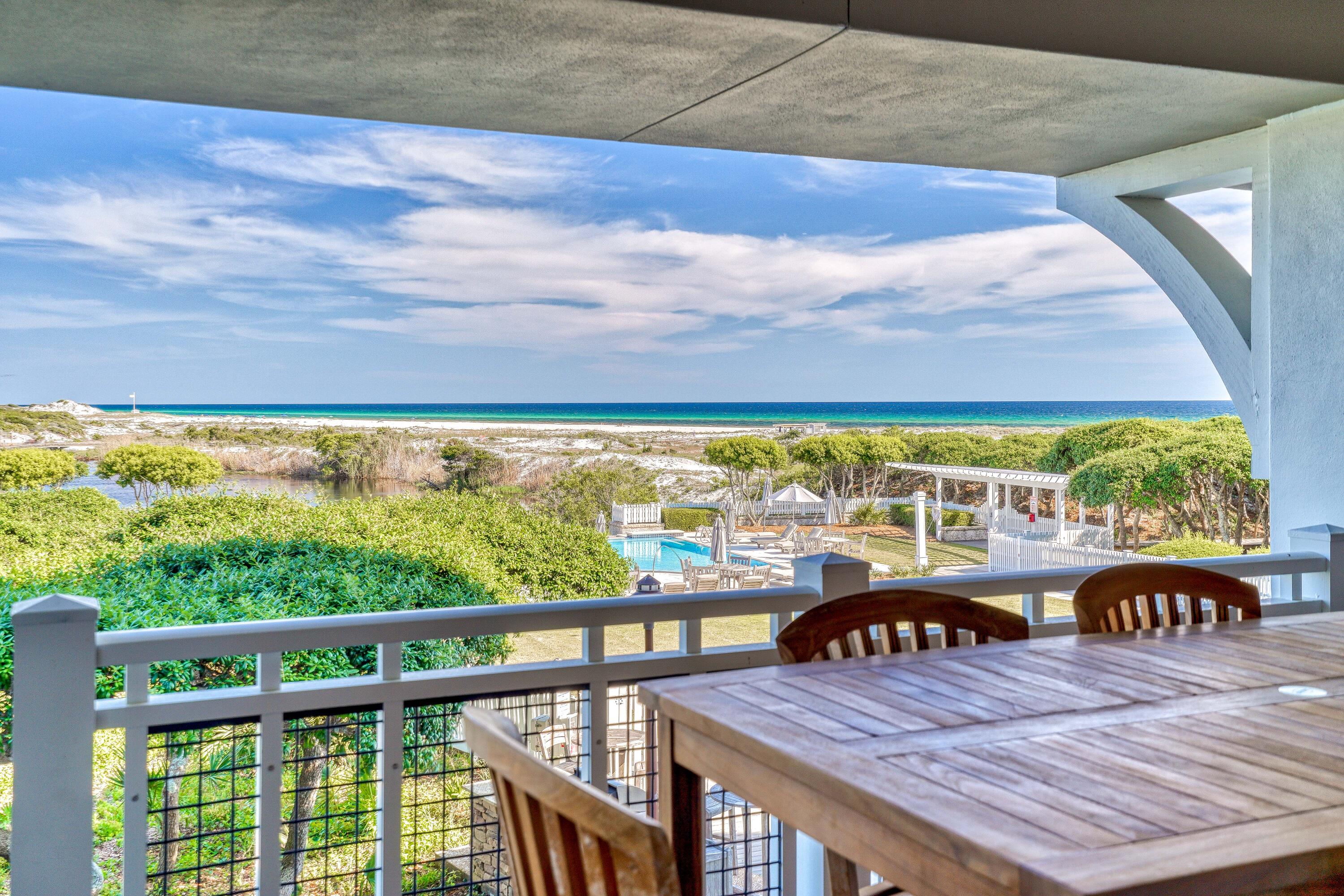 Newly updated 2 story condo located in the private gated Watersound Beach community with spectacular views of the dunes, beaches and Gulf of Mexico! This bright and relaxing unit is located on the ground floor just steps to the beach and pool. The interior boasts 3BR / 3.5BA  with an attached garage and offering the possibility of adding a bunk room in the office. The first floor master suite features private screened in patio with lounge seating, en suite bath with dual vanity sink, jetted tub, and walk-in shower, flat screen TV, dresser plus his and hers closets and storage available. There is a laundry room and an office on the first floor with built in desk and shelving. The second floor features the main living area with queen sleeper sofa, dining area and gourmet kitchen with granite countertops, stainless steel appliances and a Viking gas range. There are beautiful hardwood floors throughout the main areas. Two additional bedrooms on the second level both with flat screened TVs, closet storage and private bathrooms. Located close to all that 30A has to offer; multiple beach boardwalks through the protected dunes, the best local dining, shopping and entertainment!