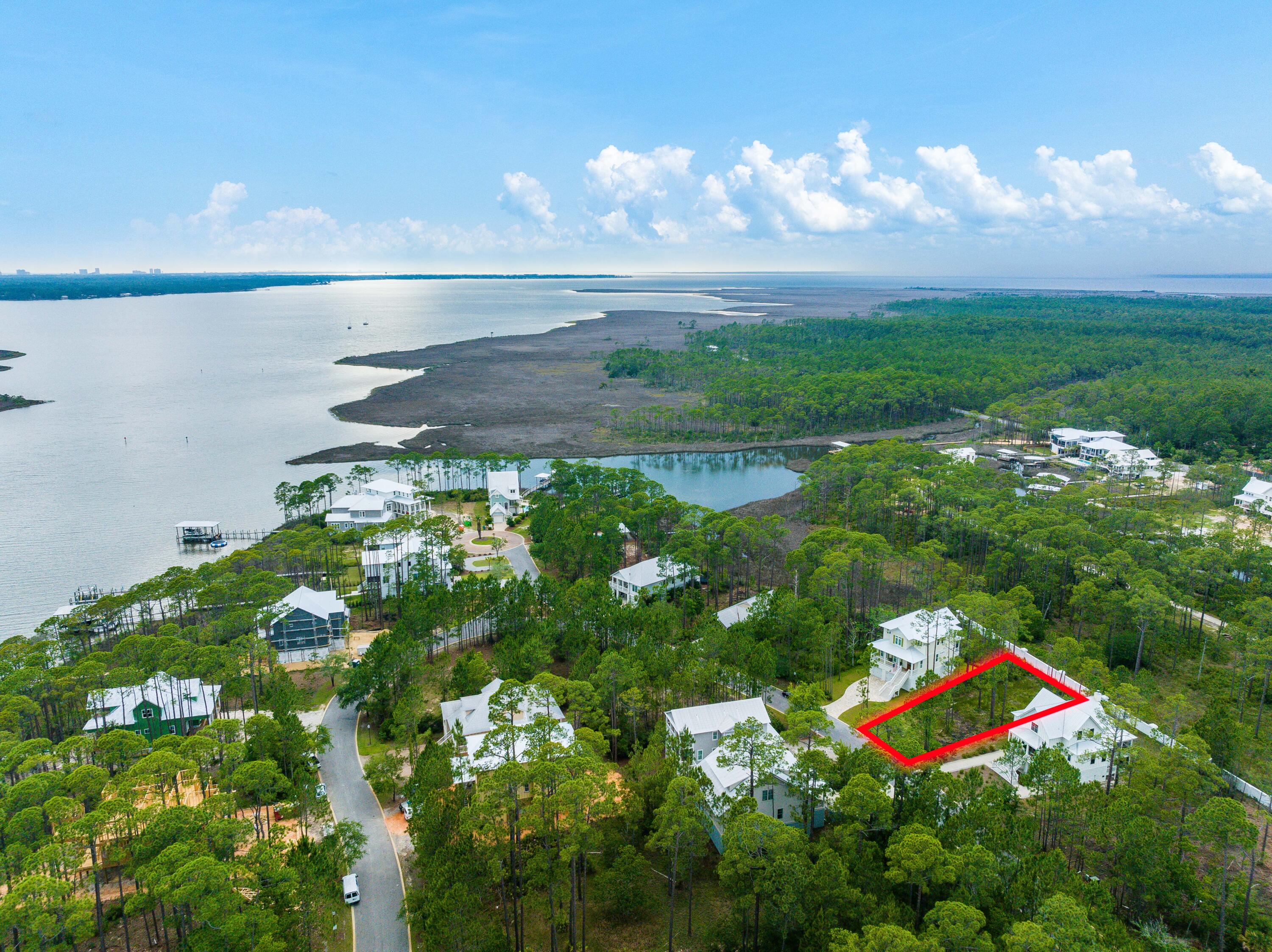Welcome to Cessna Landing, where serenity meets bayfront living! This magnificent quarter-acre lot offers an exceptional opportunity to build your dream home in a quiet, gated community nestled along the pristine shores of Choctawhatchee Bay.

As you enter Cessna Landing, you'll immediately notice the well-kept surroundings, showcasing the community's commitment to maintaining its beauty. This sought-after neighborhood boasts newer construction homes, ensuring that your investment will be surrounded by contemporary designs and modern aesthetics.

Enjoy the delightful amenities that Cessna Landing has to offer. Take a refreshing dip in the community pool on those warm summer days or head down to the private dock, providing direct access to the breathtaking Choctawhatchee Bay.  Whether you're an avid boater or simply love waterfront activities, this bayfront community is perfect for water enthusiasts of all kinds.

Cessna Landing also places high importance on maintaining the peaceful ambiance of the neighborhood. Short-term rental restrictions ensure that the tranquility of the community is preserved, allowing you to fully immerse yourself in the peaceful surroundings.

With a convenient location near the Cessna Landing boat launch, you'll have easy access to exploring the beauty of the bay at your leisure. Furthermore, just a short drive away are the numerous beach accesses on the west end of 30A, providing endless opportunities to soak up the sun and enjoy the pristine white sands that this area is renowned for.

In addition to its stunning location, Cessna Landing offers a sense of security with its gated entrance, ensuring your privacy and peace of mind. Homeowners in this community contribute $500 per quarter in HOA dues, which go towards maintaining the community's amenities and overall upkeep.

Don't miss your chance to own this extraordinary quarter-acre lot in Cessna Landing, an idyllic bayfront community with newer construction homes, short-term rental restrictions, and a host of desirable amenities. Build your ideal home in this tranquil oasis and start living the life you've always dreamed of.