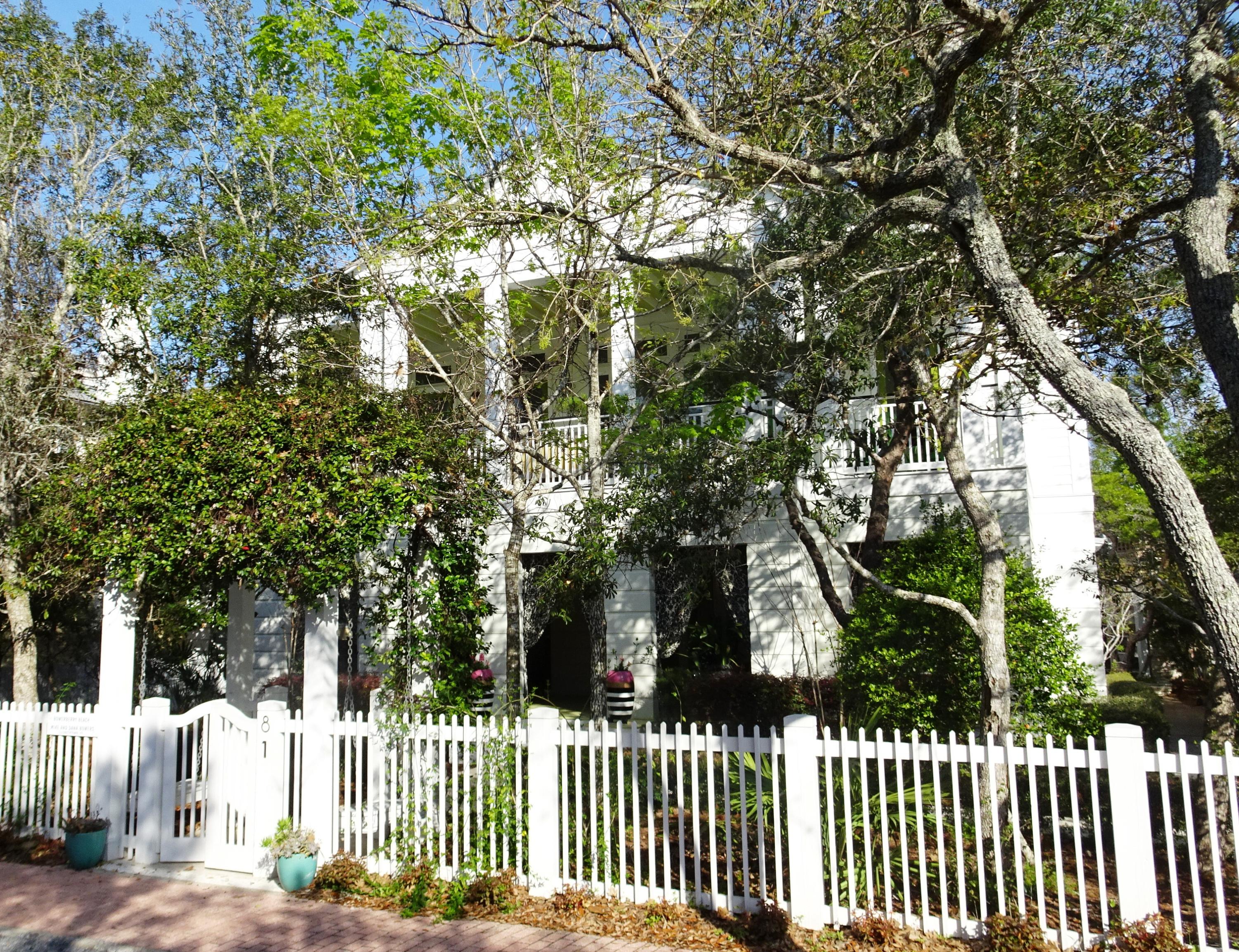 This stately home of classical design is grandly poised at the corner of the Seaside Avenue and E. Ruskin Street. The design employs densely organized classical elements made transparent with the use of tall windows on the upper floor. With all living spaces on the second level, these important public rooms enjoy a 16' gabled ceiling and exposed structure. 10' transomed windows and doors opening onto the spacious veranda flood the second floor with abundant natural light. The extraordinary kitchen is a chef's dream proudly boasting all top-of-the-line appliances: GE Monogram gas range/oven with 6 burners, griddle, dual oven and stock pot faucet, dual Subzero refrigerators with four freezer drawers, two Fisher Paykel double-drawer dishwashers, Subzero dual beverage
(continued).... refrigerators, two sinks, two appliance cubbies, GE warming oven, two garbage bins, Sharp microwave drawer, trash compactor and oodles of cabinets!  The large dining and living areas perfectly complement each other and offer plenty of room for entertaining.  Life spills out onto the veranda for enjoying time together with family and friends.  An adjacent office with fireplace supplies a cozy nook for when you need to do business.  Topping the second level is a snuggly sleeping loft and then the magnificent tower taking in all of Seaside.  The first level houses four bedrooms and four baths plus laundry room.  The great front porch sets the tone for the rest of this fabulous home.  Outdoor living and dining are abundant here with the manicured grounds and outdoor kitchen, gracefully shaded by a by an ivy-covered portico.  A two-bedroom, two-bath guest house offers additional room for family.