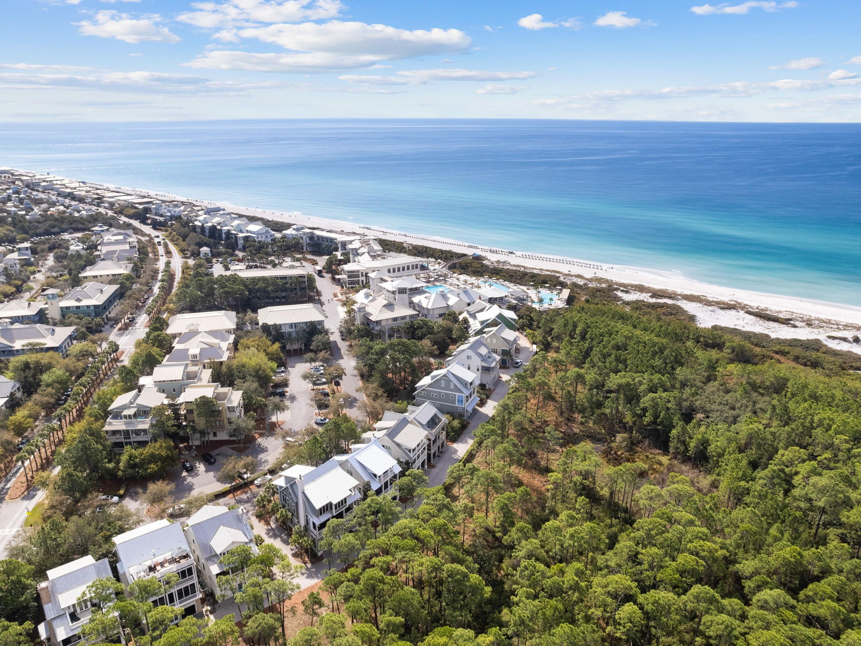 Here is that rare opportunity to be able to offer your buyers a home on iconic Park Row Lane in Watercolor!  This gorgeous home which has been lovingly cared for by its owners as their primary home has never been rented - and it shows.  South of 30A and literally just steps to the beach club this house will not disappoint as either a family home or vacation rental.  The owners renovated the kitchen and converted the top floor into a magnificent primary suite with morning kitchen.  The roof line was modified to allow for the expansion of the porch to encompass the width of the home and offer views of the Gulf.  The original primary bedroom suite remains. A large living room and dining room with access to another very large porch overlooking state forest and Western Lake beyond completes this gem.