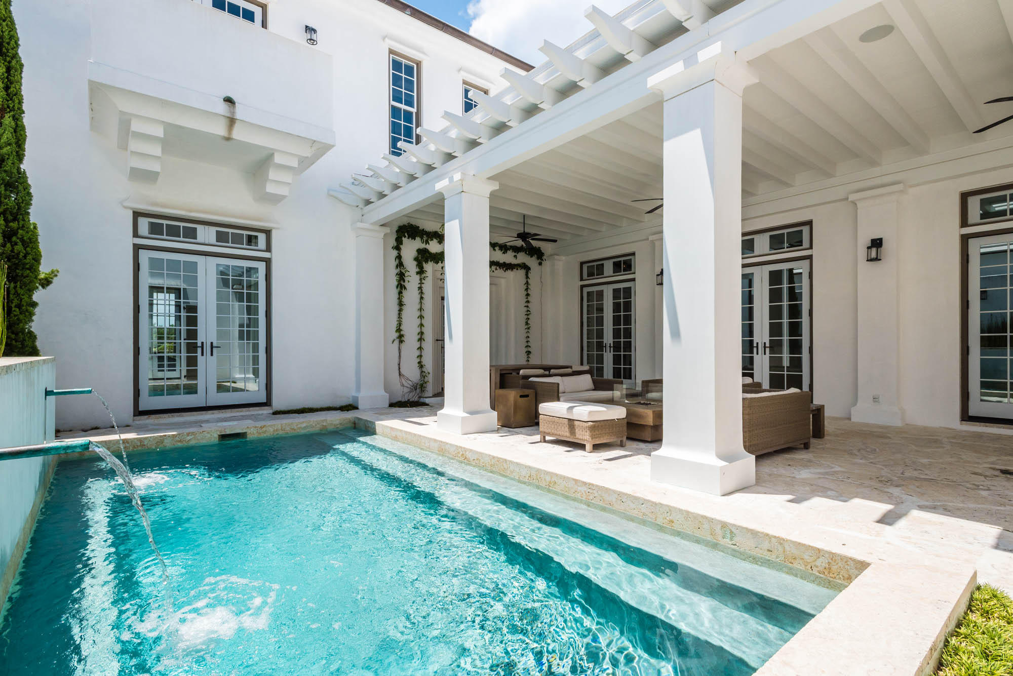 This 3,075 square-foot architectural masterpiece showcases 4 bedrooms + bunk room with 4.5 baths offering soothing natural light throughout the home. A large kitchen with island separates the dining room and living room centered for perfect entertaining. A guest bedroom with ensuite bunk room is located just off the foyer which opens to the very large courtyard showcasing the generous swimming pool. The courtyard loggia is covered allowing for all day usage with lush green landscaping surrounding the pool creating a peaceful setting. Just off the courtyard is a private guest bedroom that is separate from the main house having its own roof terrace above. The second floor is dedicated to the master suite and a 4th bedroom. The master suite captivates Alys Beach architecture to the core having a private balcony overlooking the home's courtyard.