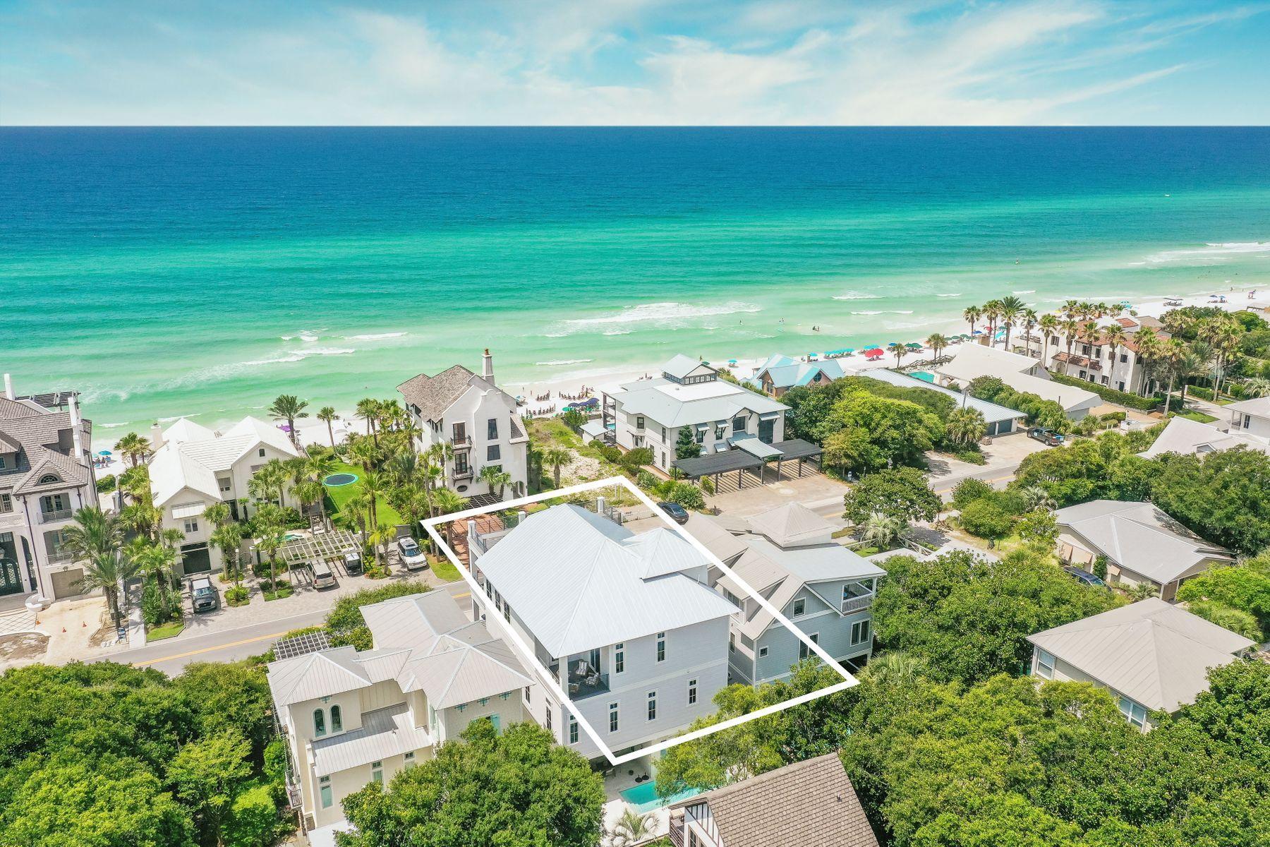 Located just east of Seaside, this professionally-decorated and fully-furnished beach home features 4,391 sqft of living space, a private heated pool, an attached garage, a private elevator and inspiring views of the Gulf of Mexico. An ideal investment property or vacation home, this coastal retreat is conveniently situated one row off the gulf, and access to the beach is just across the street from this residence.

With three floors of living space, interior features include hand screen-printed wallpaper, custom tile in the bathrooms, unique light fixtures throughout, and a spiral staircase that leads to a rooftop deck with spectacular views. The first floor offers an entertainment area, wet bar, a guest room with built-in bunks and private bathroom. Three guest suites can be found on the second floor, along with the owner's retreat, which offers its own walk-in closet, private bath with a soaker tub, and gulf views. The main living area is on the third floor, along with a wet bar, an additional guest suite, a convenient half bath, and a gourmet kitchen with Wolf appliances. 

Several outdoor spaces lend themselves to enjoying sea breezes and warm weather. A private backyard includes a heated pool, summer kitchen, and an outdoor dining area. Two balconies on the third floor offer plenty of room for entertaining, and a spacious rooftop observation deck is the perfect place to catch coastal sunrises and sunsets.