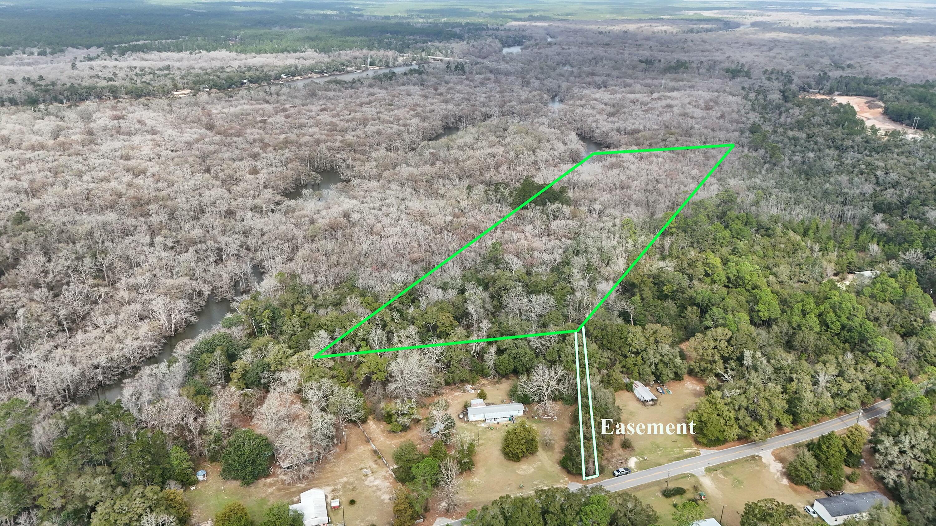Sellers are accepting OFFERS!!! Come check out this 7.5 ACRE WATERFRONT parcel of land in Ebro, FL. New Survey Available. Property has a newly recorded 22ft Access Easement. Located just North of some of the World's Most Beautiful Beaches. Just minutes away from Ebro's Poker Room, Dollar General, Subway, public boat launches, state park, gas station, and Ebro community center. Perfect for your hunting or fishing getaway. There was an old trailer and may still be a septic tank and water well but sellers aren't for sure; and doesn't know the condition if they are on the property. Wheelhouse Engineering has completed a feasibility study and will offer dozen of house plans to choose from at no charge. Call your favorite Realtor today and make this parcel yours!