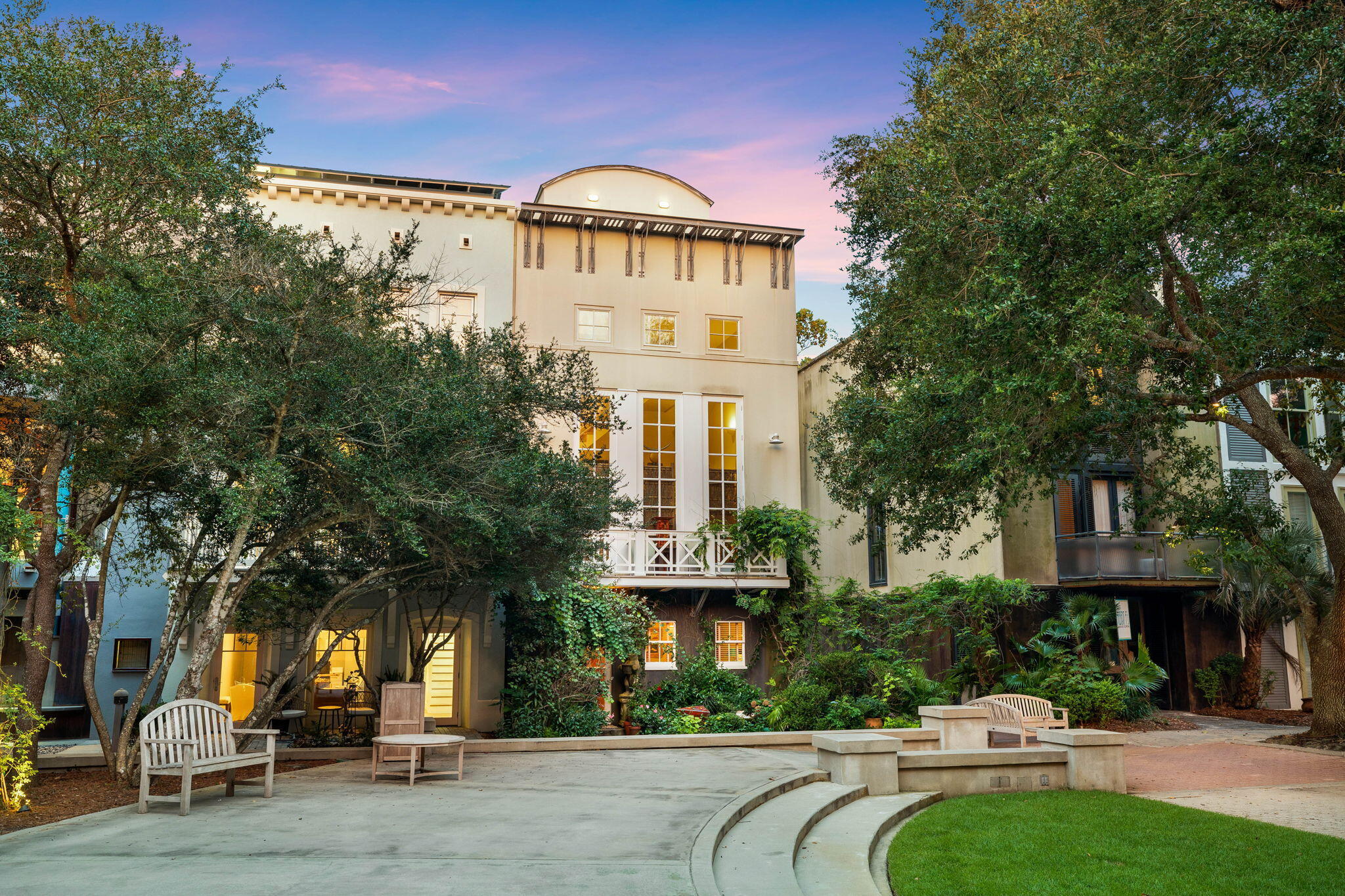 Nestled in the heart of Seaside, this unique Ruskin Place residence overlooks the town center and showcases stunning views of the famed emerald waters of the Gulf of Mexico. Designed by renowned architect Alexander Gorlin, this iconic residence truly characterizes quintessential Seaside. The exterior classical design was based on a tripartite Italian palazzo scheme and exhibits a modernist emphasis on flat, planar surfaces and simplified forms, with an industrial-type interpretation of a cornice in galvanized steel. The interior space is modern and features a double-height living area behind the three twelve-foot-high French doors set providing views into Ruskin Park.  An open staircase winds around a central pier uniting the ground floor with the rooftop office.  This processional stair, which also acts as a skylight, emerges from the cozy area of the lower level into the high space of the living room and onto the roof deck, finally revealing a view of the Gulf of Mexico.  

Boasting a superior location fronting picturesque Ruskin Park, the welcoming entry invites you to experience luxury coastal living at its finest. Immerse yourself in the tranquil surroundings, lined with a grove of lush vegetation and sidewalks that lead to a delightful array of shops, dining and entertainment. 

The first level of this home features two junior suites, each with its own private bath. A perfect arrangement for guests seeking privacy and comfort. Ascend the Brazilian mahogany steps to the second level entrance, you'll be captivated by the light-filled living area. Custom made glass doors reach up to a 20' ceiling, infusing the room with abundant natural light. The expansive walls provide an art collector's dream canvas to showcase your prized collection. The adjacent dining area seamlessly connects to a spacious sitting area, creating an open and inviting atmosphere. The modern kitchen features an island breakfast bar, granite countertops, maple cabinetry, stainless appliances, and stunning tile and oak floors. 

Climb the open staircase, making a dramatic architectural statement, and you'll find the primary suite on the third level. French doors open to a serene private balcony providing a sanctuary of relaxation.

The fourth level presents an enclosed tower; providing a perfect space an office, entertaining area or reading nook. The rooftop terrace flanks the tower on the east and west sides, granting breathtaking views of Seaside rooftops, the Gulf of Mexico, and mesmerizing sunsets. Inquire today to make this iconic Seaside sanctuary yours!