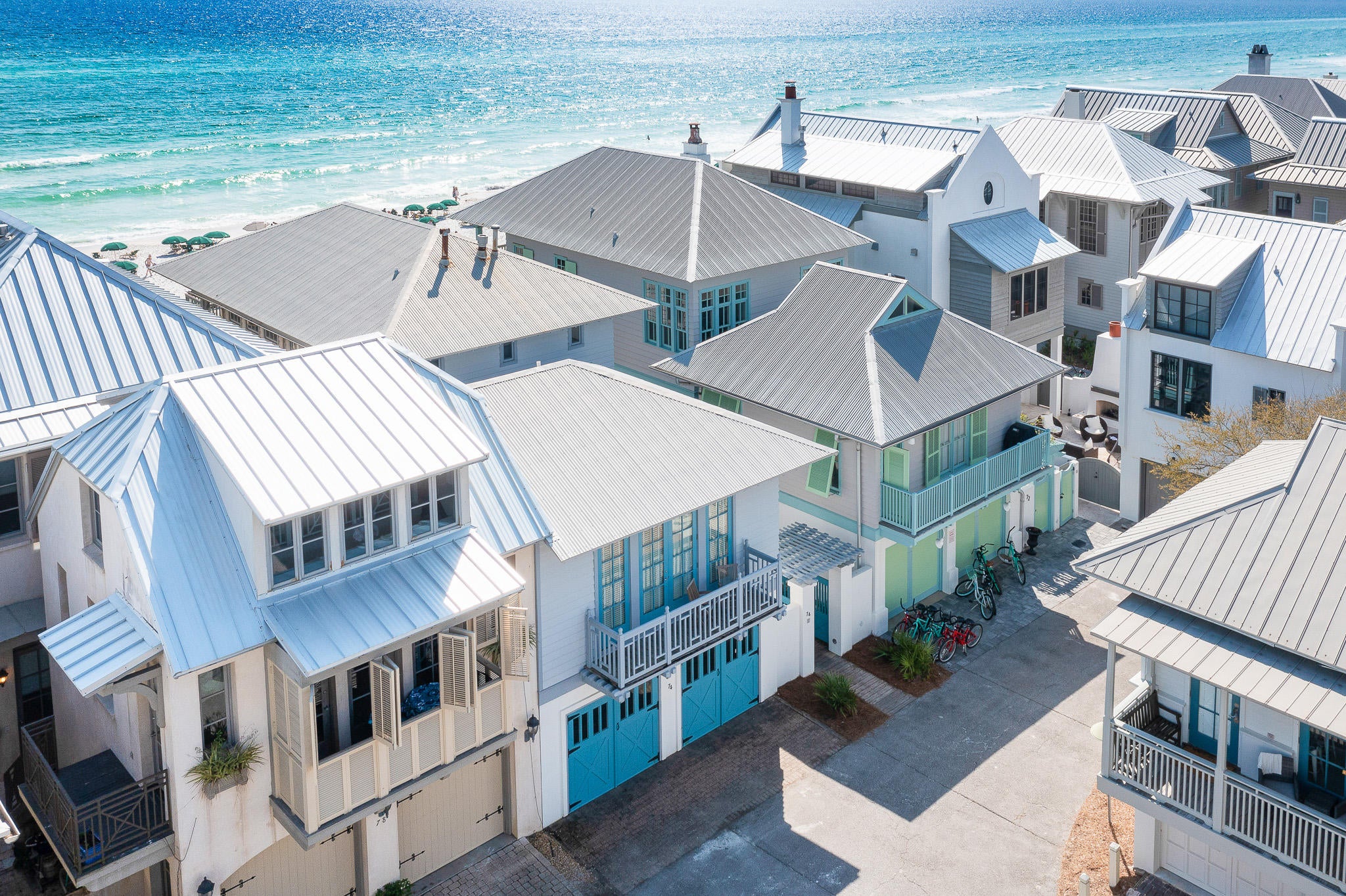 Gulf-front in Rosemary Beach!  This charming and idyllic beach house, with 2-car garage and carriage house, was designed by renowned architect Gary Justiss and built by the talented Benoit Laurent.  Still treasured by its original owner, this home has been impeccably maintained. The main house offers three bedrooms and three bathrooms and an additional bedroom and bathroom is found in the lovely carriage house which also has a comfortable living area and full-service guest house kitchen. The entrance to the residence, through the gated courtyard is warm and inviting. The home features hardwood flooring and built-in shelving throughout, making the most of the space.. On the first floor you can discover the spacious Gulf-front master suite with incredible views, a beautiful en-suite bathroom with soaking tub and an office space, the "She Shed" that will make work seem like play as you look out over the Gulf! You will also find a charming guest room with private bath.  Take the stairs to the second level and take in the abundance of natural light flowing throughout with the cathedral ceiling and large windows offering panoramic views that bring a delightful warmth to the main living area and offer extraordinary sunset views everyday.  The open living and dining room partner with the expansive second floor porch to provide room to entertain a gathering of friends and family.  Another guest room with bathroom is on this level.  The separate carriage house offers a spacious floor plan with full kitchen and living areas, as well a large bedroom with balcony and bath.   An ideal location, Gulf-front, on Rosemary's east side, lends a quieter, tucked away spot, while just a pleasant stroll to the bustling activities of Town Center and also steps to the beach walkover. Rosemary Beach embraces the principles of traditional town planning with a pedestrian friendly design. With its brick-lined streets, charming town center, unique shops and locally-owned cafes, locals and guests alike delight in this picturesque 30A community. Discover Gulf-front living at 74 Windward Lane and enjoy the pedestrian-friendly coastal lifestyle of the iconic new urban community of Rosemary Beach.  Buyer to verify all dimensions.