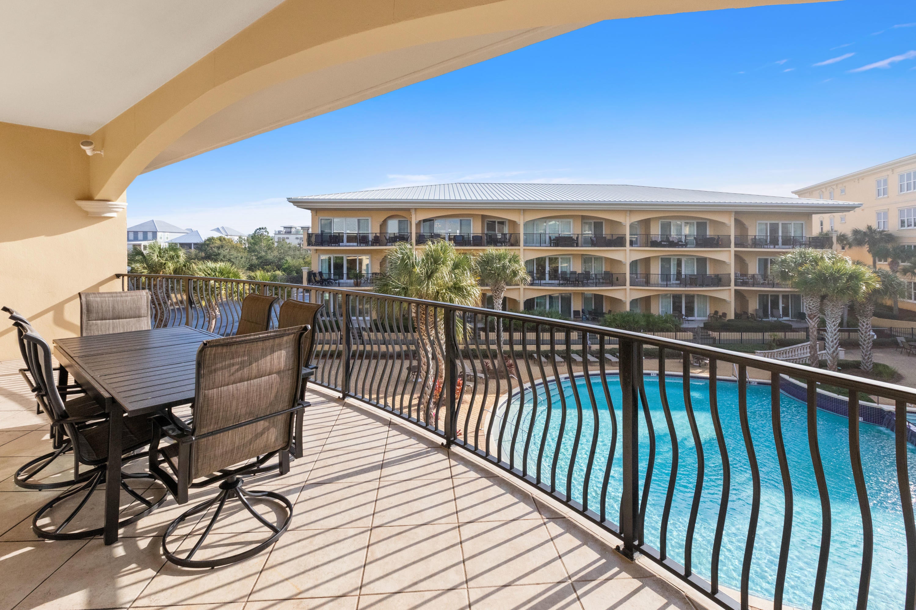 This three bedroom, poolside condo at Adagio has a view of the Gulf of Mexico from its covered balcony. **New interior paint throughout, including all cabinets.** This luxurious unit features ten foot ceilings accented by crown molding, granite counters, stainless steel kitchen appliances that include a gas range, gorgeous travertine floors, and so much more. The spacious balcony offers room to relax while overlooking the pools and enjoying the sea breeze, and is accessed from both the living area and master suite. Adagio is an 11-acre gated complex that boasts wonderful amenities including a gym, meeting room, grills, additional Gulf-front pool, and 600 feet of private beach. The perfect paradise! 2019 Rentals: $42,364.72