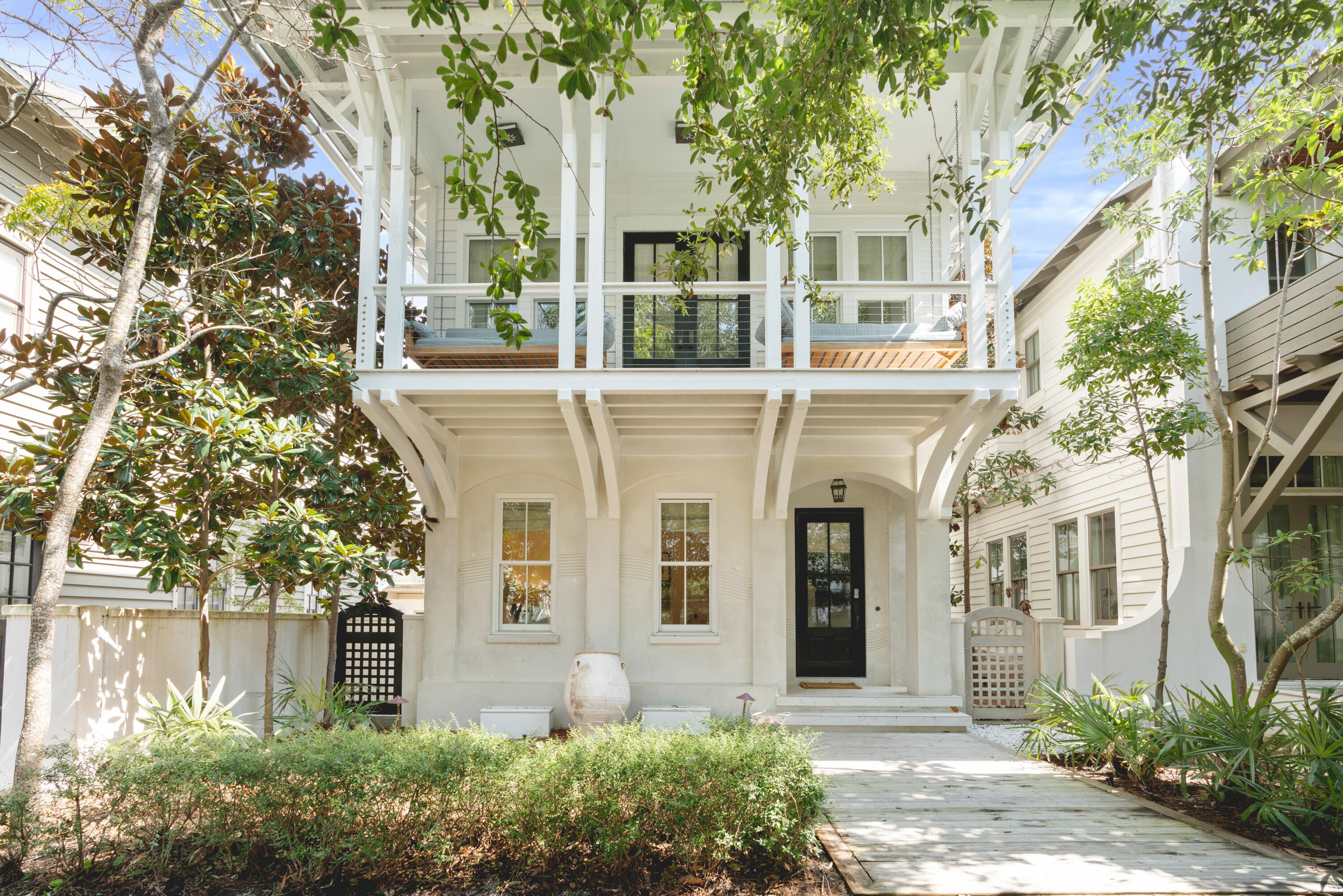 Serene, sophisticated and nothing short of sensational. This custom beach home embodies the true meaning of relaxed elegance while living up to the world class, family fun atmosphere that Rosemary Beach is known for. The spacious main house boasts four bedrooms and three baths and just across the inviting courtyard the carriage house contains two bedrooms and two full bathrooms. The first floor of this home has a comfortable den with seating for 4 and a flat screen TV, a great hangout for the kids. Off this den is a bunk room with 2 full beds, a flat screen TV and an attached bathroom with a large walk-in shower. Continuing down the hall, you will find the first king bedroom with attached bathroom. The bathroom attached to this bedroom has a vanity with granite countertops and a tiled tub/shower combination.
Head up the stairs to the second floor and you will find a powder room off the kitchen as well as a wet bar and ice maker.
The kitchen has beautiful, dark granite countertops that contrast magnificently with the natural light filling this main living space.
The kitchen has high-end appliances to make whipping up any meal a breeze.
There's also a large bar top off the kitchen and a seating area  that's perfect for relaxing and keeping the chef company while they're cooking.
Continuing with this wonderful open-concept space you will find the living room with a large, flat screen TV and plenty of seating, as well as an inclusive dining area.
There's also a master suite located on the 2nd floor. The master bedroom boasts a king bed and a private en suite.
Another wonderful feature of this 2nd floor is the large covered balcony with 2 large porch swings. This is the absolute perfect spot to relax with a book, simply enjoy the fresh air, or take an afternoon nap after a day at the beach.
Take the stairs up to the 3rd floor and you will find another lounging space with flat screen TV, and chaise lounge. This floor also has 2 queen bedrooms and a shared full bathroom with double vanity and tub/shower combination.
Continuing on to the newly renovated carriage house, you'll find it beautifully appointed and with a large open living space complete with a comfy sectional couch and flat screen TV.
There's also a dining area plus a well-equipped kitchen.
The carriage house has a queen bedroom with an attached bathroom, including a granite vanity and tub/shower combination.
Take the spiral staircase up and you will find a sleeping loft with a king bed.
There is also a second bathroom off this space with a granite vanity and glass walk-in shower.
Located steps from the Rosemary Racquet Club, Fitness Center and spectacular private Rosemary Beaches, this property would make an exceptional rental investment or 2nd home. Contact us today to see it for yourself.
Please verify all information deemed important.