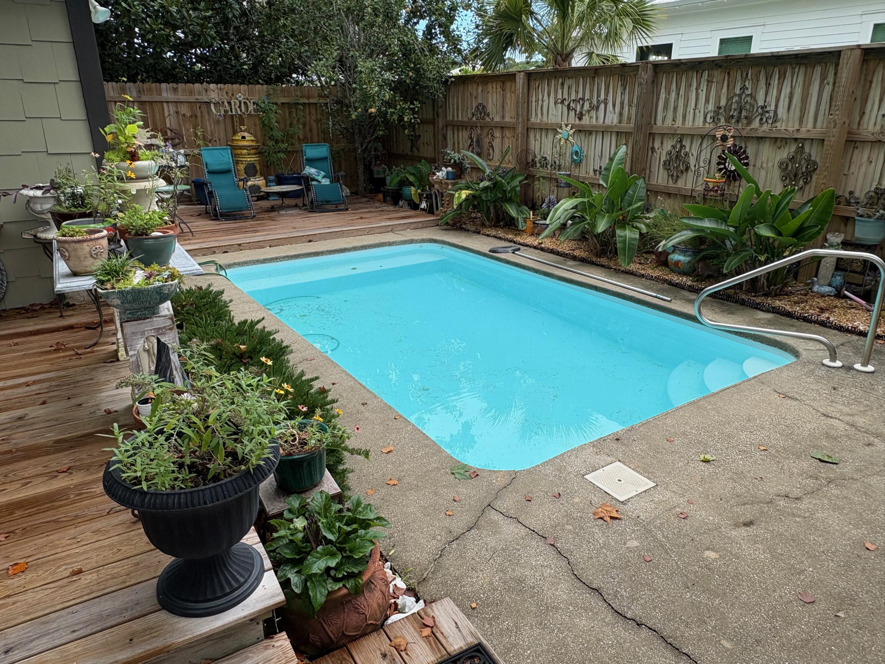 Ideal location in the First Addition of Gulfview Heights. Cool little Florida cottage nestled in the woods close to the Beach. Restaurants and shopping are close by.  You must see this location in person! Trails everywhere, beach a few blocks away. The square footage taken from the county record, however, the Master wing was added, making the house more like 2,000 sq ft. The backyard has a 10 ft privacy fence.  Oasis in the backyard with a nice pool.