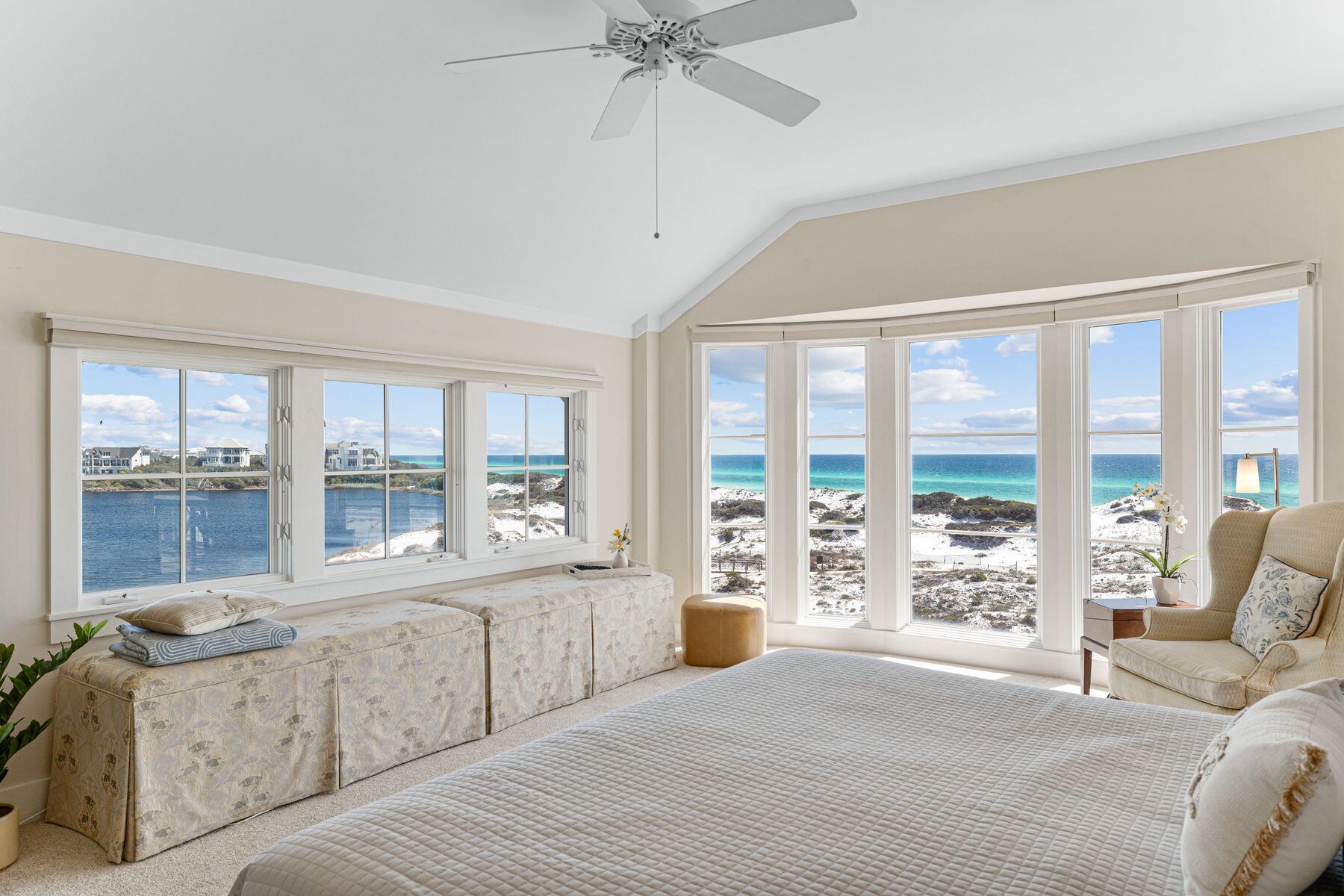 This rare top-floor end unit at The Crossings at WaterSound Beach is all about the views. Wake up in the primary suite, raise the remote-controlled electronic window treatments and take in stunning views of Camp Creek Lake and the Gulf of Mexico through two walls of windows including a magnificent floor-to-ceiling bay window. Views of the lake and shimmering Gulf of Mexico are equally breathtaking from the living room, kitchen, dining room and second bedroom. Wood flooring and feature windows enhance the stunning sitting room which shares the panoramic vista with the dining room and kitchen. The kitchen has a full range of wood cabinets, stainless steel appliances and granite countertops for smoothly preparing tasty snacks and gourmet meals.