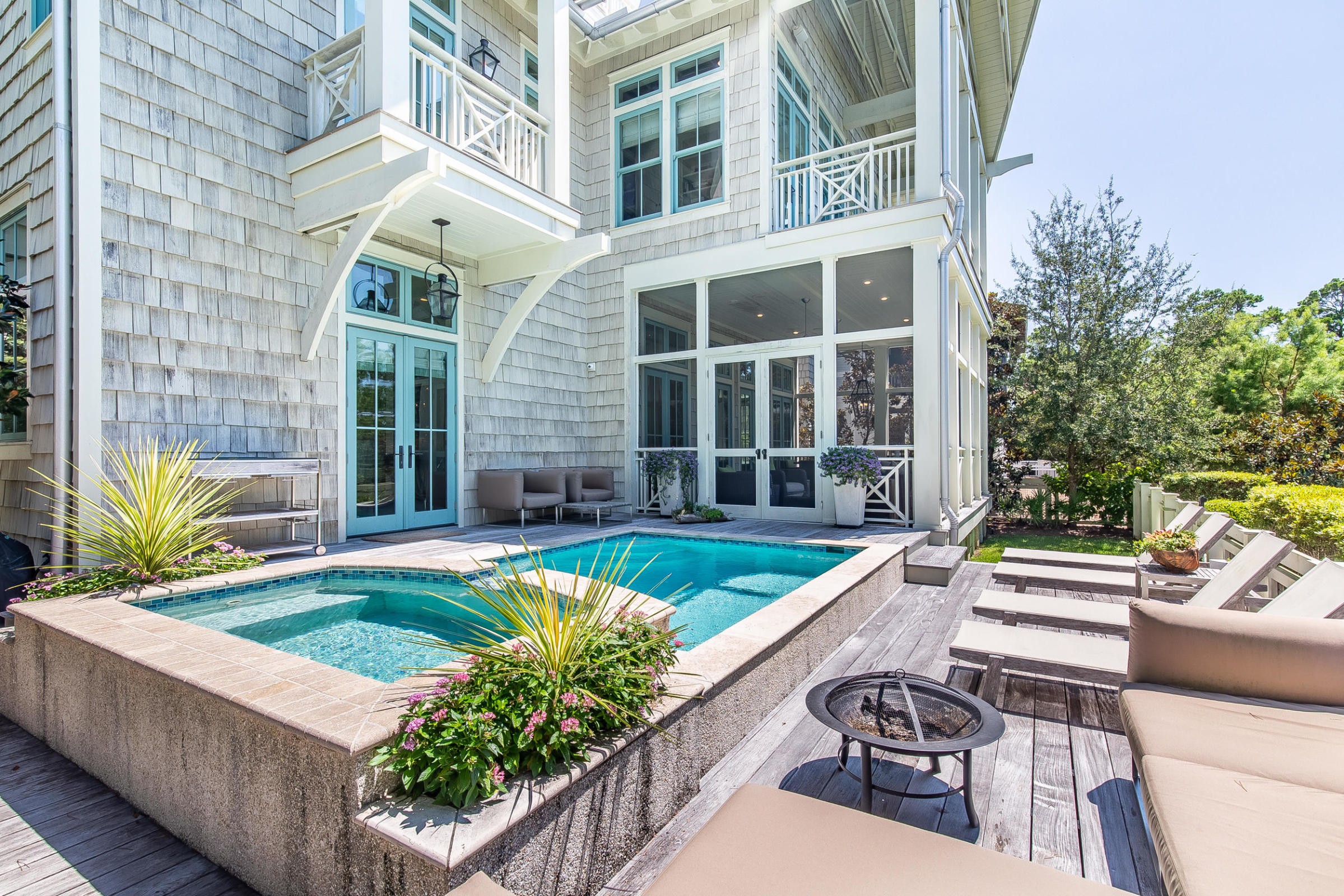 This 4-Story WaterColor home greets you with the warm glow of gas lanterns and includes beautiful views of Western Lake. With 5,446 sq ft, this home offers plenty of room for entertaining on all levels! This spacious 5 BR / 6/2 BA home has a detached 2-car garage, carriage house, and private pool! Luxurious finishes and features span throughout the home including French limestone, antique white oak, and Calcutta Marble flooring, shiplap walls, venitian plaster walls, exposed antique beams, pecky cypress ceilings and more! The first floor chef's kitchen features a large island made of limestone and Calcutta Gold marble, custom cabinets, double 36'' Sub-Zero glass front refrigerator, Wolf double oven with gas range+ hood, wine cooler, 2 dishwashers and much more! The second floor Master suite is full of natural light and balcony views of the lake. The large Master suite features a sitting room centered around the fireplace, a large walk-in closet with sliding barn doors, midnight kitchen/wetbar, double vanity, seperate shower and soaker tub. The third floor provides a family area and leads up to the 4th floor lookout with a wetbar and grogeous balcony views of Western Lake!