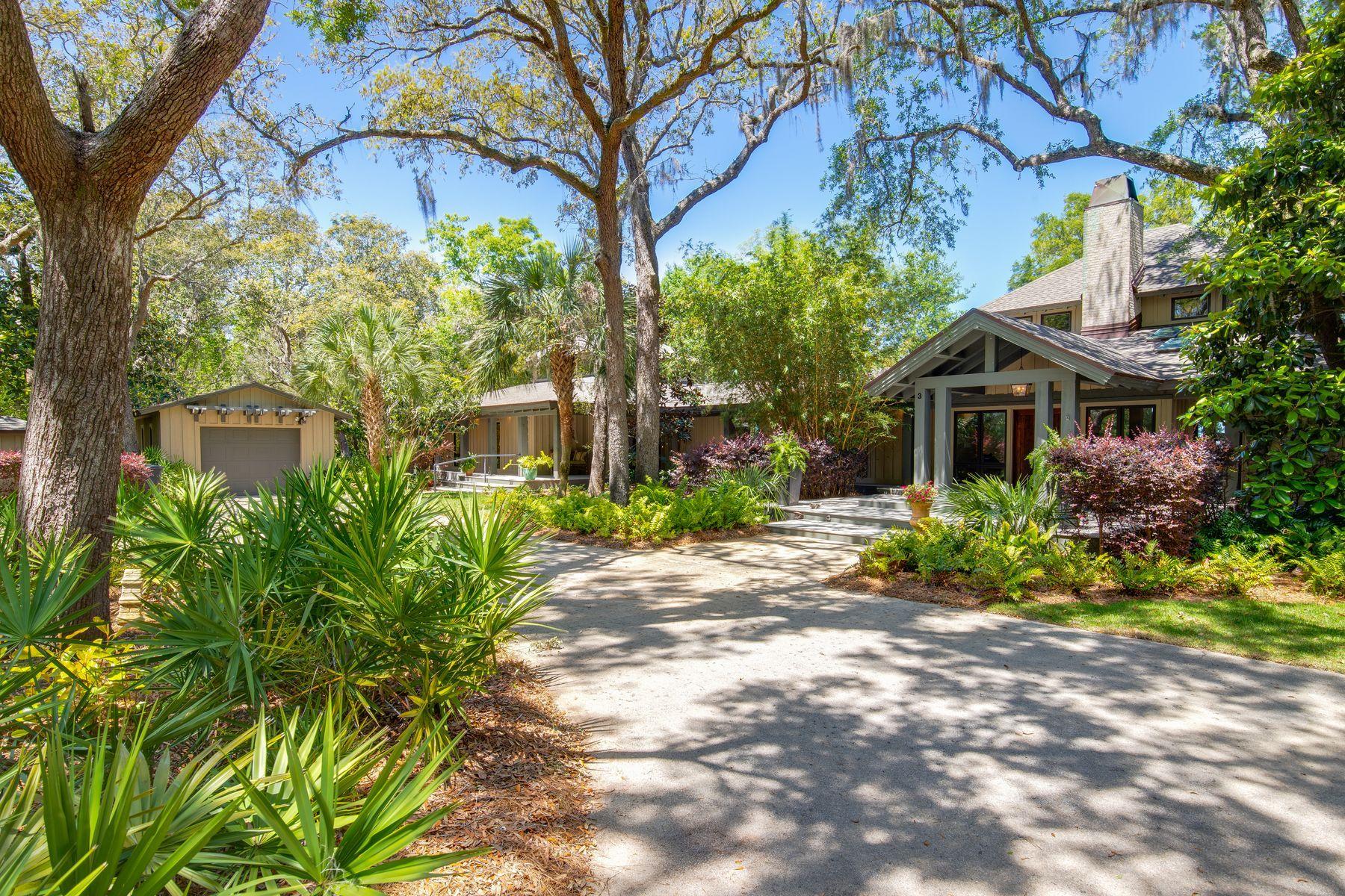 Situated beneath the sweeping boughs of mature oaks on its one-acre Bay-front site, this re-envisioned dwelling combines its traditional, Southern-style exterior with contemporary, well-sequenced living spaces. Rustic, natural elements such as rough-sawn, Cypress wood beams are incorporated with refined finishes and modern fixtures to create a harmonious atmosphere that is artistically composed and at the same time comfortable and inviting to live in. A dramatic wood-burning fireplace in the living room dictates flow from the main entrance into either the private master bedroom suite, occupying the east end of this single-level home, or the dining and living rooms. The master bedroom features views to the Bay and access to a tremendous, 16 by 36-foot screened porch. Each living space opens onto a screened or covered porch, increasing the home's capacity for indoor to outdoor entertaining. A natural stone paved patio surrounded by lush landscaping leads to a 16 by 40-foot swimming pool and is gently terraced to 220 feet of Bay frontage where a dock extends to a boat house, equipped with four lifts. A detached cottage is convenient to the dock for relaxing after a day on the water, escaping the main house or accommodating guests. It features its own kitchenette and bath. The Chef's kitchen has stainless steel appliances, solid Cherry wood cabinets, slate tile floors and solid slab granite countertops occupies a central location in the main house between the dining and family rooms, enjoying views over the patio to the Bay. Three guest bedrooms with vaulted, wood beam and paneled ceilings occupy the west end of the home. An exceptional floor plan and balanced use of materials creates a harmonious atmosphere that captures both the spirit of the original structure and conveniences of modern living.