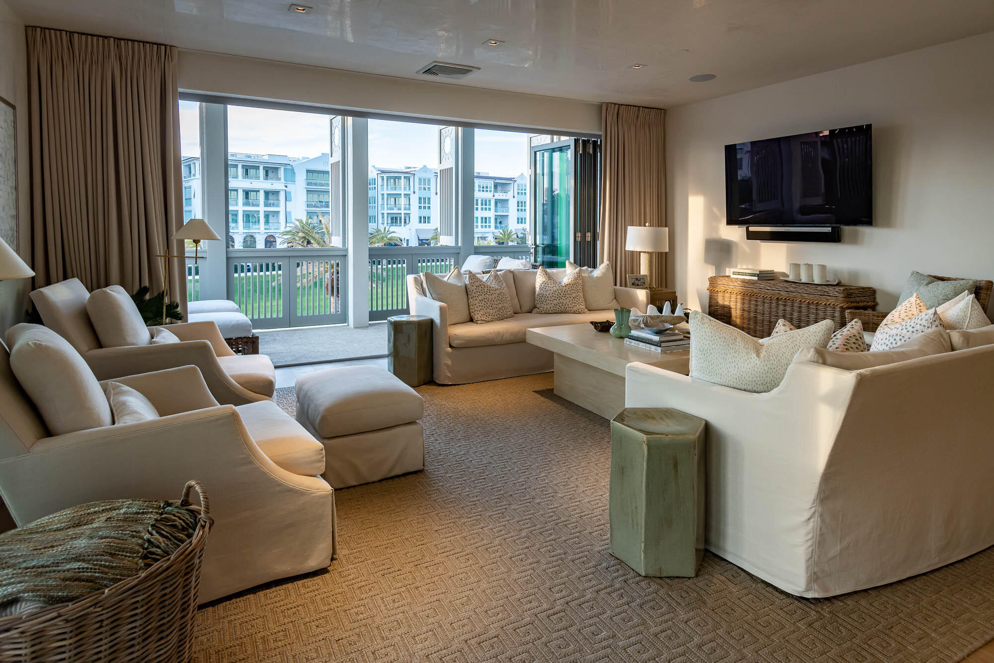 The May is a four story condominium featuring eight residences located on the prominent southeast corner of the Alys Beach Town Center. This two bedroom east end residence provides westerly views from the spacious shuttered 21 foot wide balcony overlooking the Alys Beach Ampitheatre and Scenic 30A. Open the large bi-fold doors connecting the living, dining, and kitchen are to the balcony to provide open indoor/outdoor living space. A second balcony is located to the rear of the residence off the master bedroom and guest bedroom providing morning sunrises over 30A to the East. A third 16 foot wide balcony off the Living/Dining Room offers Southerly views over Scenic 30A.