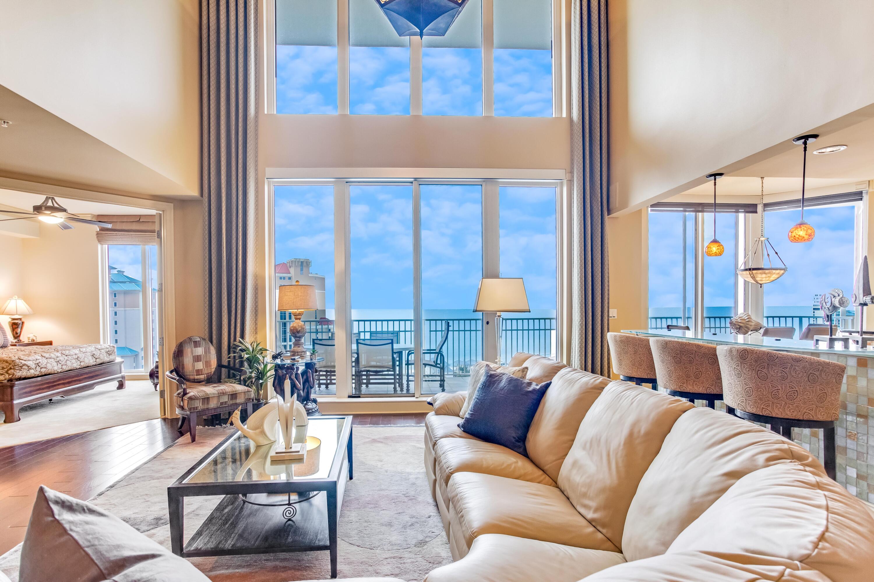 Live in one of Sandestin's preeminent and exclusive 2-story penthouses showcasing stunning views of the emerald, green waters of the gulf coast from every bedroom. This coveted residence comes with a deeded, double car enclosed garage. The interior is par none featuring a balance of rich hardwood, limestone tile and plush carpet flooring, glass breakfast bar, tinted windows, electric sunshades, full surround sound , coffered/trey ceilings, accent lighting in the kitchen cabinets and under bath vanities, and a grand living area open to the 2nd floor with an imported chandelier. The main floor features 2 beds, 2.5 baths, formal dining area with a wet bar, and a well-equipped kitchen and breakfast nook. The 2nd floor boasts an additional guest suite and a new, transformed primary wing. The primary suite has been completely remodeled into a private wing featuring an executive office with built-in bookshelf, wainscoting, and mini-fridge, 2 full baths shared by a walk-through shower, 2 walk-in closets and a French balcony off the bedroom. Beautiful, intricate marble tile with wood inlay flows throughout the hall, office and full bath. One Beach Club Drive is a gated, rental restricted community boasting second to none on site amenities to include a new pickle ball court, media room, fitness center, library, entertainment lounge, and a resort style pool with an outdoor kitchen. In addition, there are onsite guest suites available for rent exclusively for owners of One Beach Club Drive. Each unit also transfers with a membership in Sandestin's private Beach Club which is adjacent to the property, offering beach and pool services. One Beach Club Drive does have private poolside cabanas and covered golf cart parking that is deeded and sold separately. 
As an introduction to the Sandestin lifestyle, we invite our new owners to explore amenities that make Sandestin special. The listing brokerage and seller(s) are presenting the buyer(s) of this property with (2) 90-minute rounds of Tennis court time, a golf foursome at one of our three championship courses, and a round of golf for up to four (4) players at the unrivaled Burnt Pine Golf Club.