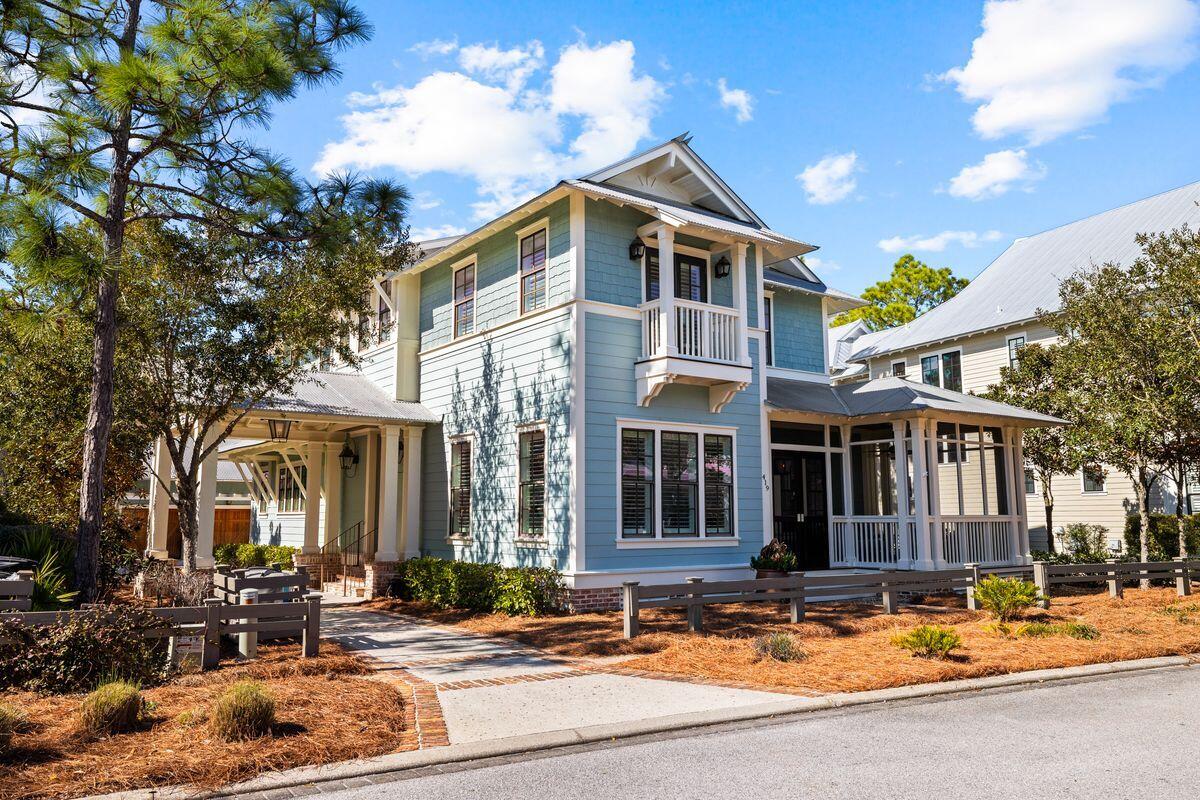 Beautifully designed and very well maintained, this upgraded five-bed home with carriage house and three-car garage built by John Brown of Gulfview Construction has a stunning outdoor living area with fireplace and water feature. The saltwater lagoon pool takes center stage with a bubbling spillover spa, restful cabana and a covered porch with summer kitchen, ice maker and grill. Screened by mature trees in a conservation area, the quarter-acre lot is perfect for outdoor Florida living. The main entrance to the home is through a screened front porch. Step into the entrance foyer with sawn oak flooring leading the way into one of several sitting rooms, this one with plantation shutters and an adjoining wet bar. The newly updated upscale kitchen is filled with stainless appliances including a six-burner stove range with double oven and a Miele coffee/cappuccino maker. Lit by a trio of pendular lights, the extensive island doubles as a breakfast bar to complement the adjoining dining area. There's ample storage throughout the home, including a walk-in pantry and laundry. The first-floor master suite is a self-contained haven with its own fireplace and doors to a private porch revealing pool views. Twin vanities with copper sinks and a clawfoot tub feature in the master bath while sliding doors conceal his-and-hers walk-in closets. The family sitting room with fireplace extends into the shady rear porch. Upstairs, the home has many more surprises including a landing with office nook, a bunk room and a generous guest bedroom with ensuite bath and balcony access. Stairs lead up to the sprawling attic space that has huge potential. Rounding off the home there's a long driveway leading to the garage. With built-in cabinets, it's a dream workshop or storage space for vehicles, bikes and watersports equipment. The adjacent guest house has its own private entrance and includes a bedroom, bathroom and sitting area. All this comes with amazing WaterColor amenities nearby. Families will appreciate Camp WaterColor, multiple pools, tennis, sports courts, bike trails and a fully equipped boathouse on Western Lake. For those who want more, there's an exclusive Beach Club with pool and dining terrace for enjoying the ultimate views over the Gulf of Mexico.