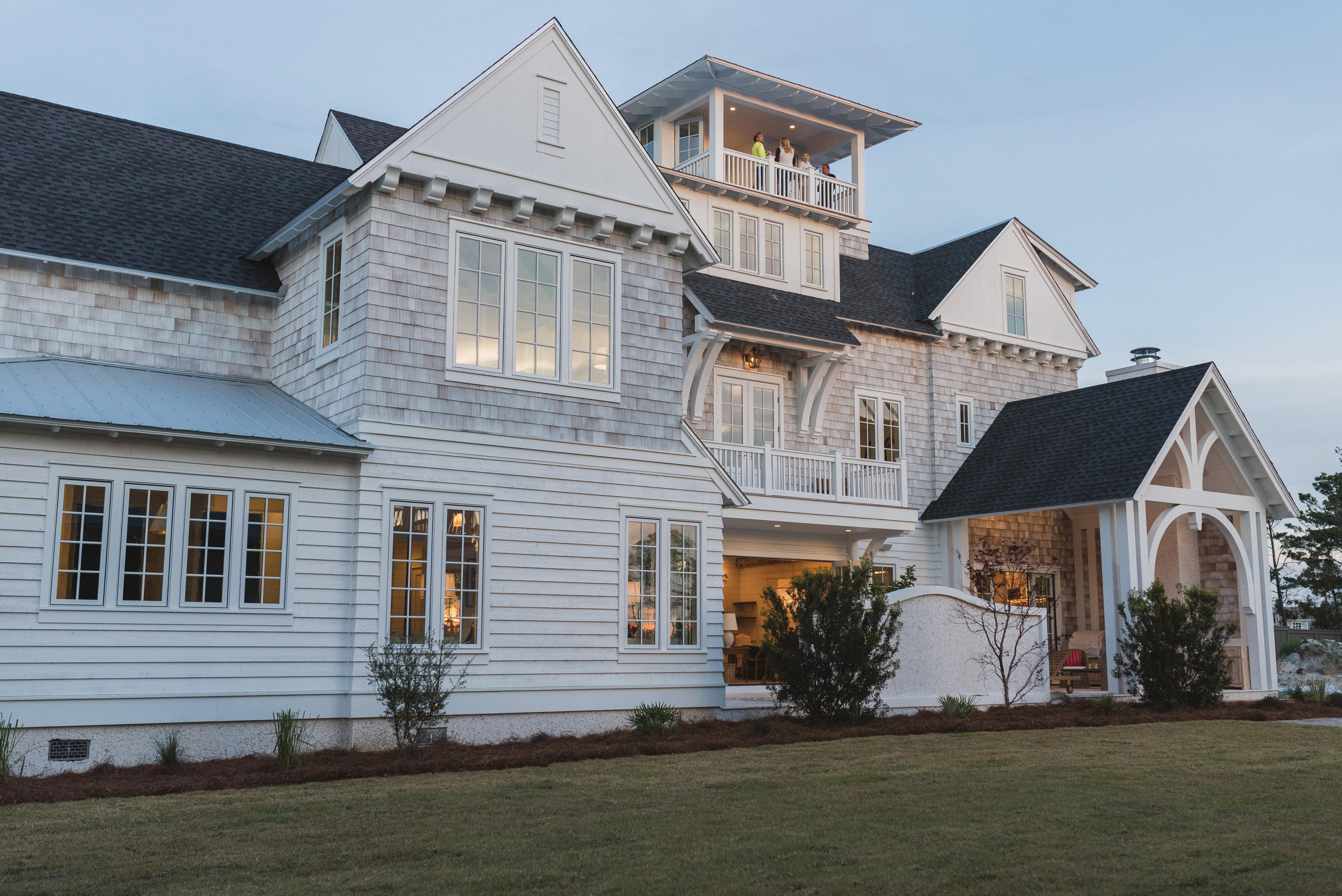Enjoy the breathtaking views from this iconic Grace Point Coastal Manor, ready for the next steward to begin a new chapter of 30A living at its very best. This exemplary property is being offered with a custom designer furnishings package and boasts a balanced blend of yesteryear and today's modern amenities, with a layout well suited for a multi-generational family. The striking 300-year-old hand-hewn beams will captivate you the moment you step into this very special home. The gracious family room is anchored by a tabby shell fireplace with custom built-ins, the room is complete with custom wine cellar and offers natural life through the Nano doors which provide indoor and outdoor living. The courtyard pool and patio include an outdoor kitchen and fireplace. Beyond is the dining room table, handcrafted expressly for this home. The kitchen is a chef's dream with an oversized island, custom cabinetry, multiple prep stations and Subzero and Wolf appliance packages and quartz countertops. The first- floor master suite with private courtyard access and ensuite offers Carrera marble, custom cabinets and large walk-in glass shower. An oversized 1st floor laundry room and powder room completes the first floor. The hardwood floors throughout the home are milled at a family wood mill in Albany, GA and are of reclaimed barn wood glazed and sealed for a distinctive elegance on every level.
Taking the elevator to the second floor, this level offers multiple family areas for reading, games or movie nights, balconies and large light-filled rooms. Each junior suite is complete with private bath, outfitted in Carrera marble, and boasts hand-hewn beams accenting the 10 foot ceilings. A second level bunk room offers 4 Queen built-in bunks and the ensuite bath boasts three sinks, walk-in shower and walk in closet.  
The third level of the home is dedicated to the second master suite. The open foyer includes a morning kitchen and entry to the master bedroom. To the right is the en-suite  bath with large soaking tub, walk-in shower, Carrera marble flooring, oversized walk-in closet with custom wooden shelving throughout and quartz countertops. To the left are the sleeping quarters with 10 foot ceilings and complimentary hand-hewn beams. Large windows allow natural light to fill the room.
One can simply step off their front porch and walk thru the manicured park to the WaterSound Beach Club and easily access the beach through the private gate. The fourth floor tower can be accessed via stairs or elevator, and enchants the viewer with its stunning emerald water backdrops and endless sunsets! You must see to truly appreciate!