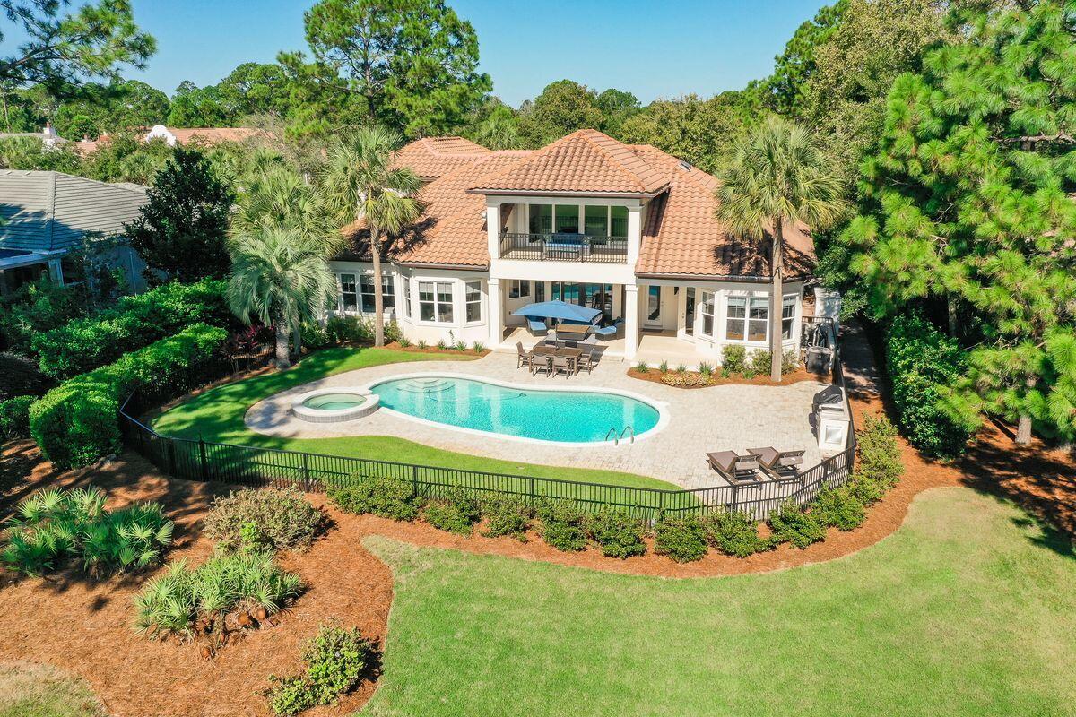 This pristinely remodeled stunner offers expansive views of The Raven Golf Course's Hole #2 and will impress you from the second you walk through the door! 1513 Island Green was fully remodeled in 2018 by Compass Builders, with even more updates added since. The home will truly check almost any box for desired needs and wants, with a list of upgrades so long it will need to be emailed your way. A small sample of the numerous highlights include two new HVAC units, Full security system, Cummins whole house generator, Bosch and Subzero appliances, Woven Wood Shades throughout, Heated and Chilled Salt Water Pool featuring LED colored changing lights and Hot Tub, Premium Home Theater/Surround Sound Systems in the Living, Bonus Room, and outdoor patio spaces, Tailored Living Custom Closet... Organizers, wall mounted flat screen TV's, Stone fireplace surround, crown molding, custom built outdoor BBQ Island with a Twin Eagle Grill that allows for Pellet Fed Smoking, Twin Eagle side Burners, and so much more. Entertaining is a dream with two living areas, dining room, half bath with pool access, guest bedroom, guest bath and office or additional bedroom downstairs; and a guest bedroom, guest bath and entertaining area upstairs with an oversized, covered balcony and lush golf course views. If cooking while entertaining is your passion, you will love the beautiful and efficient chefs' kitchen with stainless-steel appliances, an island with breakfast bar and an in-kitchen dining area that has a door to the pool and patio. The master suite is spacious and conveniently located on the first floor with access to the pool. The expansive living spaces throughout the home are flooded with natural light. The laundry room was completely updated in 2020 and features new tile floors, cabinets, farmhouse sink, and a new front-end loading LG washer/dryer set that also conveys. The two and a half car garage has been epoxy coated and is ideal for housing a golf cart that you're sure to enjoy with all that Sandestin has to offer. Island Green at Sandestin is a private neighborhood with only 52 custom homesites. Neither short or long-term rentals are allowed in this neighborhood and all homes are owned by full-time residents or second homes for the owners to enjoy. Sandestin Golf and Resort is a major destination for all seasons and all ages. It's been named the #1 resort on Florida's Emerald Coast offers a premium lifestyle for entertaining and stellar golf and beach amenities. This beautiful 2,400-acre resort is comprised of over 70 unique neighborhoods of condominiums, villas, town homes, and estates. The Resort features more than seven miles of beaches and pristine bay front, four championship golf courses, a world-class tennis center with 12 clay courts and three hard courts, four resort swimming pools and 15 private neighborhood pools, a 123-slip marina that can accommodate vessels up to 140 feet, a fully equipped and professionally staffed fitness center and spa and 65,000 square feet of customizable meeting space. The Village of Baytowne Wharf, a charming pedestrian village with events, shopping, dining, family entertainment and nightlife and the Market Shops with additional events, dining and shopping are both accessible by tram and golf cart. For true golf cart community living, Grand Boulevard is just outside the resort gates and provides access to shopping, dining, and entertainment, all without traveling on Highway 98. Call today to view this remarkable home with an incredible attention to detail throughout.