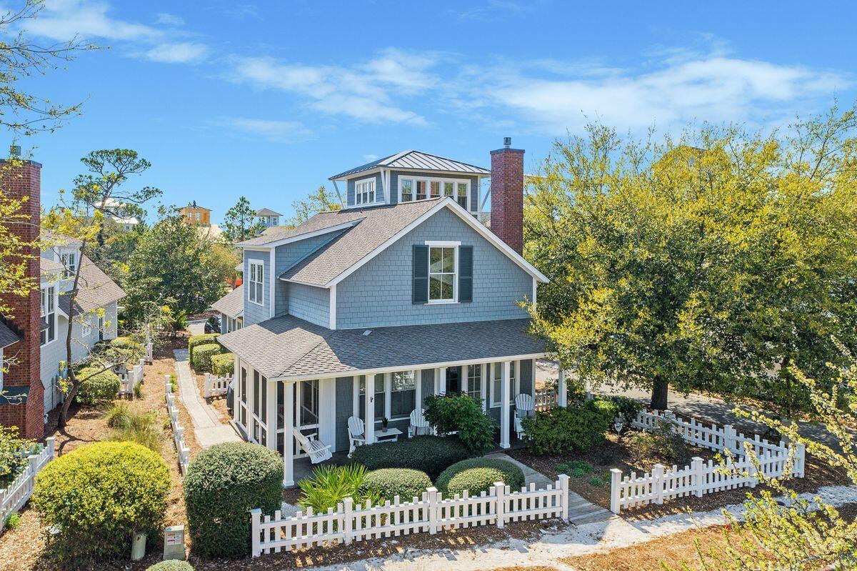 Nestled within the highly desirable community of WaterSound Beach behind the main gates, this iconic design and flawless interpretation of the Nantucket saltbox cottage offers a unique take on coastal design, decor and layout. Merely footsteps from the private sugar sand beaches of the WaterSound community, this 2,140 square foot three-bedroom home boasts three levels of interior space, plentiful porches and a darling interior sure to please primary, secondary and investment owners alike. Best of all, it is offered fully furnished with a golf cart, perfect for its next owners to create lifelong memories within. The Open concept main level provides a transitional layout for both gathering and relaxing, anchored by a gas fireplace, expansive windows and crisp painted cabinetry in the kitchen. The living space features new furniture and area rugs, crafting a fresh yet timeless ambiance in the homes most popular spaces. Stainless appliances and concrete floors provide a modern feel to the classic design, which offers two full guests suites on the main level of the home. The owner's retreat is located on the second level of the home providing unmatched privacy and convenience for those who love to entertain. Featuring an enchanting clawfoot tub, walk-in shower and dual vanities, modern luxuries exude throughout the space for a premier ownership experience. 

The third floor of the home offers a spacious flex space, easily used as a home office, a media room or a bunk room for additional accommodation opportunities. Custom millwork and designer lighting crafts an aura of exclusivity throughout the home, while freshly painted trim and fencing offer additional peace of mind. Additional features of the home include newly installed Arlo cameras around the exterior, while the hot water heater and HVAC system was replaced in 2016. The gated WaterSound Beach community located south of Scenic Highway 30A offers homeowners a rare sense of seclusion with easy access to area activities. Amenities include swimming pools, multiple parks, community green spaces, a state-of-the-art fitness center & private pedestrian & golf cart boardwalks to one of the most beautiful mile stretches of coastline in the area.