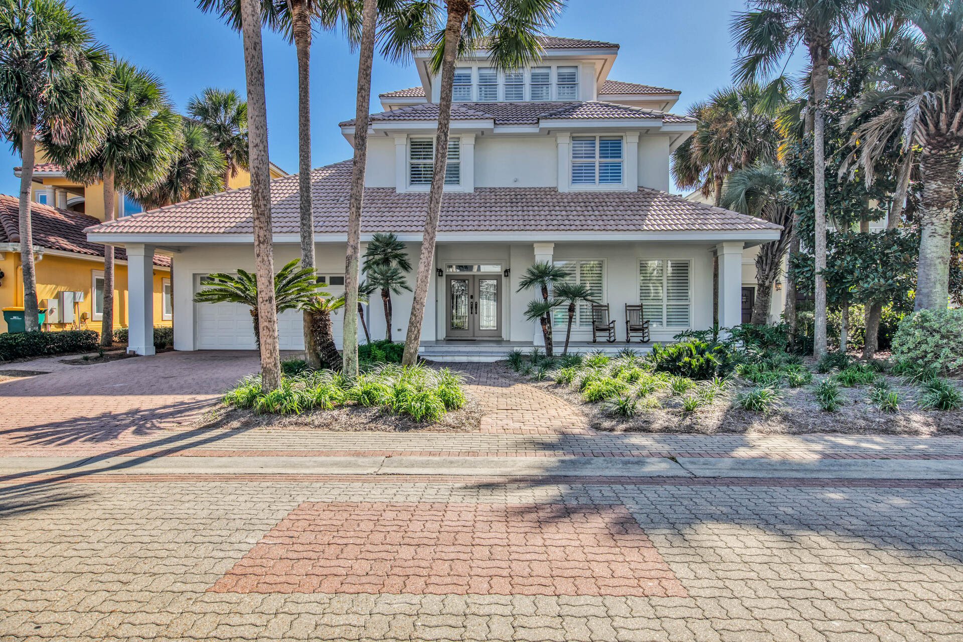Here is your opportunity to own one of Destin's Premiere Beach homes. This home offers full unobstructed gulf views and direct access to the gulf only steps away from the pool and back yard. It is like owning a Gulf front home without the extra expense.  This custom home features hand carved oak cabinetry throughout. The gourmet kitchen features a Dacor stainless steel 6 burner gas stove and convection oven, microwave, warming drawer, a large designer SubZero refrigerator, wine cooler,& separate ice makers in kitchen & laundry room. The kitchen and double islands have gorgeous  granite countertops with double ogee edge. All rooms have plantation shutters & travertine stone tile. With almost $300,000 in projected rental income this home is an investors dream. This home is permitted to sleep 30 and has parking for 6 cars. The new pool and outdoor kitchen were completed in February of 2019. Destiny amenities include a huge 30' x 75' seasonally heated community pool with a dramatic cascading waterfall, restroom with shower facilities for the pool, hot tub, fully equipped fitness center, tennis courts, meeting areas, kitchen, club house and fishing in the 22 acre lake.