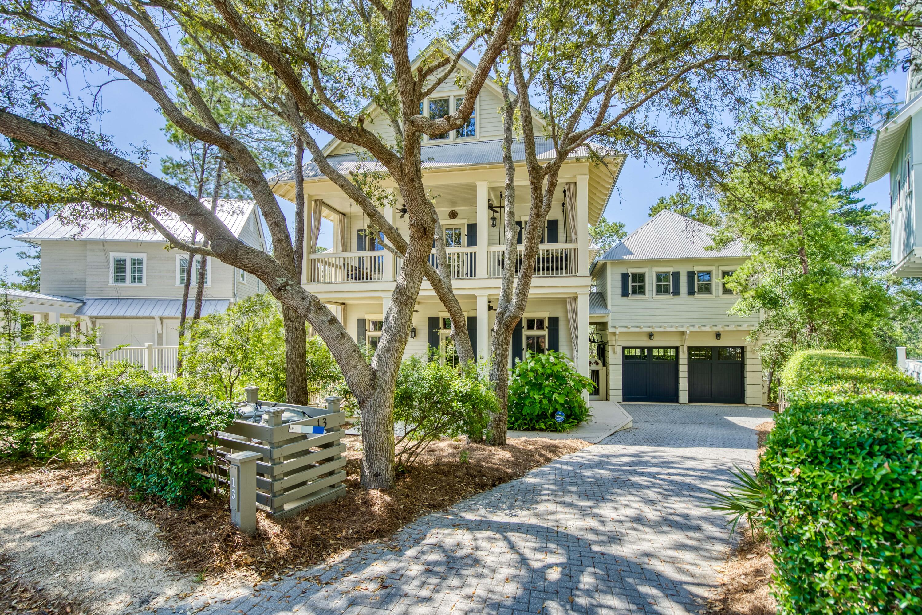 Located in the coveted community of WaterColor, this breathtaking home offers a prime location nestled on Western Lake with calming views of the lake and landscape from all three levels. The elegant entry takes your eye through the home to the lake as you are welcomed to the great room boasting soaring two story ceilings with wooden beams. Step up to enjoy the dining area and Kitchen  complete with a butler pantry and large screen porch all opening up to the lakefront views. The first floor also offers a master suite and additional sitting area. For added accessibility, this home also offers an elevator servicing all floors.  As you ascend to the second floor, the staircase surrounds you with pecky cypress walls  and ceiling. The specially designed iron staircase provide an added artistic element. The second floor hosts three bedrooms/study each with a ensuite. All three  bedrooms provide access to the screen porches. The master suite and study open up to the lake while the wide hallway wet bar is convenient for each of the rooms.

This home has no shortage of extra features. The timeless and interesting design features have been  well thought through with the utmost attention to detail, including the top floor large entertainment room complete with a pool table, TV area and sweeping lake views. The spacious and creative bunk room does not disappoint in design.

Moving to the outdoor living area on the way to the carriage house, enjoy a private soaking pool overlooking the lake perfect for enjoying throughout the year. The garage offers the ability to open up to the pool area...Great for a party! 

This is the perfect home hosting guests or enjoying time alone.