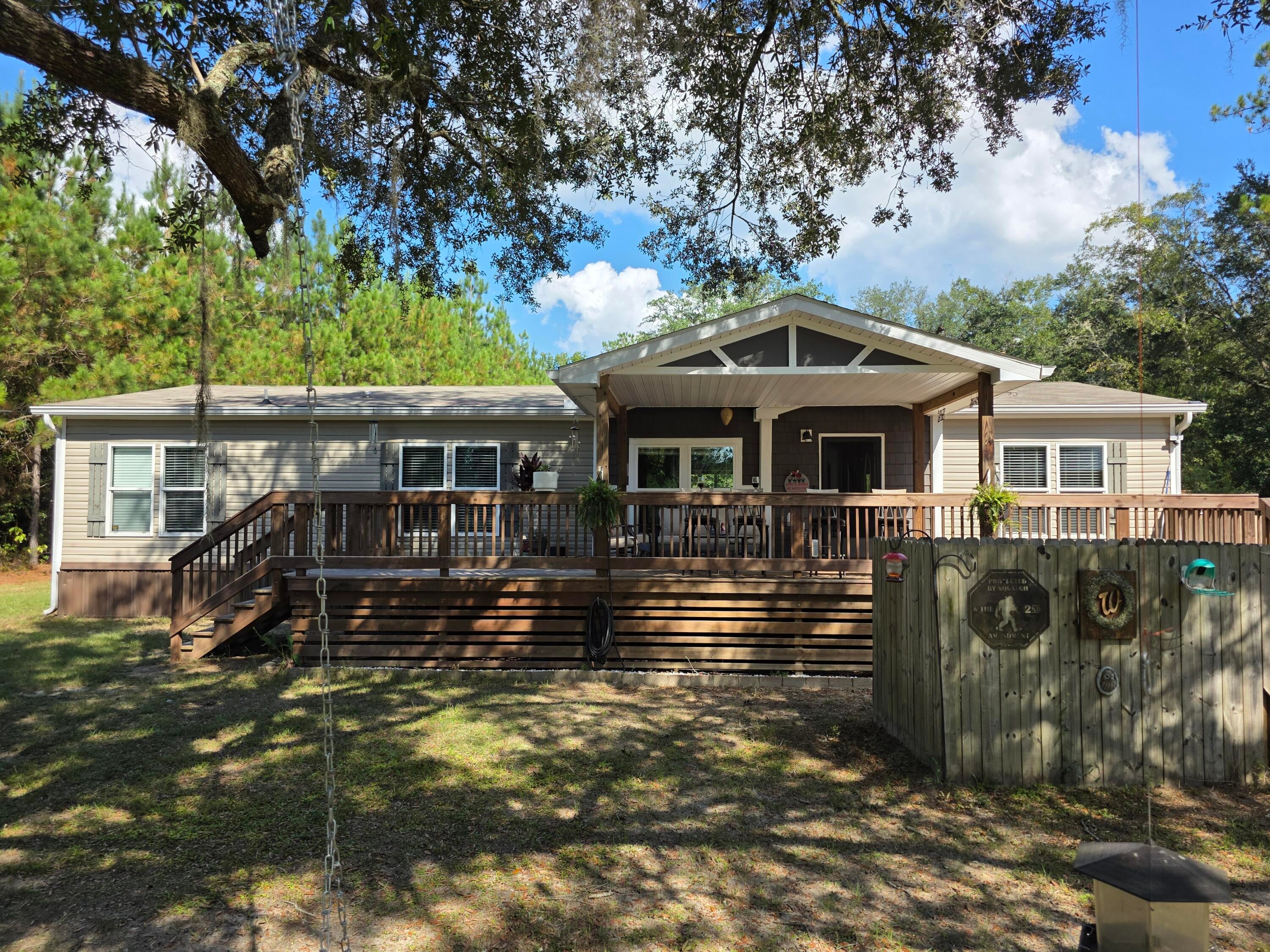 YOU CAN HAVE IT ALL!! Acreage, Privacy, Horses and MORE!  Nestled ion 19 acres just 35 Minutes to the beautiful beaches via HWY 79. Built in 2020 this  Beautiful 3 bedroom, 2 Bath 1680 Manufactured home.   home is meticulously kept. LVP, Vinyl, stainless appliances.  Move in ready.  Large  covered porch out front, out back that leads to a 29' pool. /a beautiful pool deck 16x28  and covered gazebo  12x16 for entertaining.  An oasis in itself. Pole Barn to park your cars and equipment 32x48. Detached SHE SHED 12x16 with 2 lofts for storage. Well is 142' deep.  If you are looking for quiet living this is for you. MOVE IN READY!!
