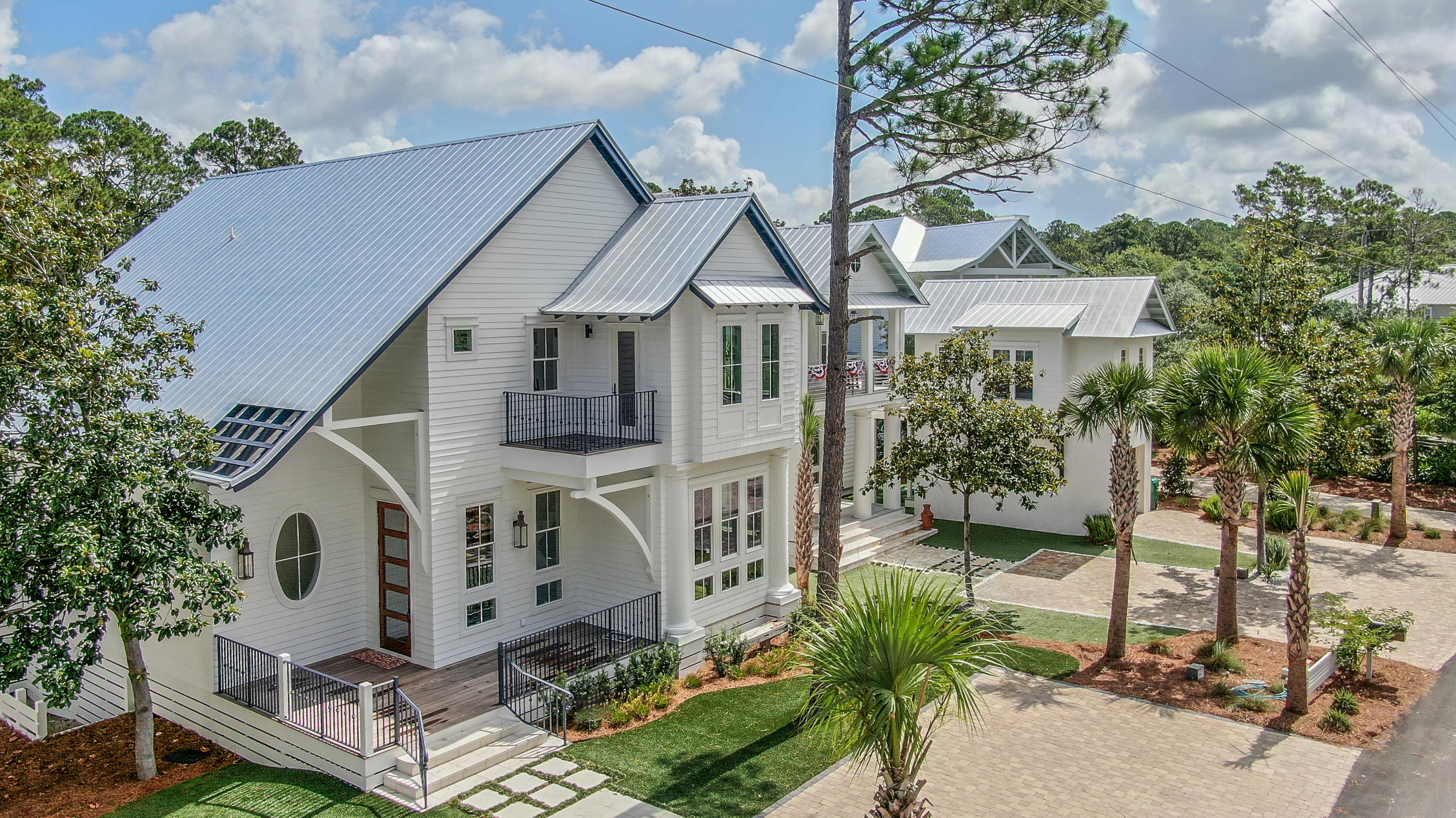 30 Canal Street offers great rental income, plenty of overflow parking, a beautiful wooded lot, 3 blocks to the white sands of the Gulf, and 3 blocks to restaurants, and entertainment at Seaside. Excellent finishes include modern lighting, custom tiles, This home is professionally designed in all areas. Antique reclaimed floors and specialty doors imported from Egypt and New Orleans. The outdoor entertainment space w pool, grilling area and outdoor dining, all enclosed by electronic screens that open/close with a push button. . We have provided storage for YOLO, boards, bikes and beach toys. Don't forget to discover our ''secret room'' for the kids to enjoy or your private hideaway to read or practice yoga. Old Seagrove location is prime!