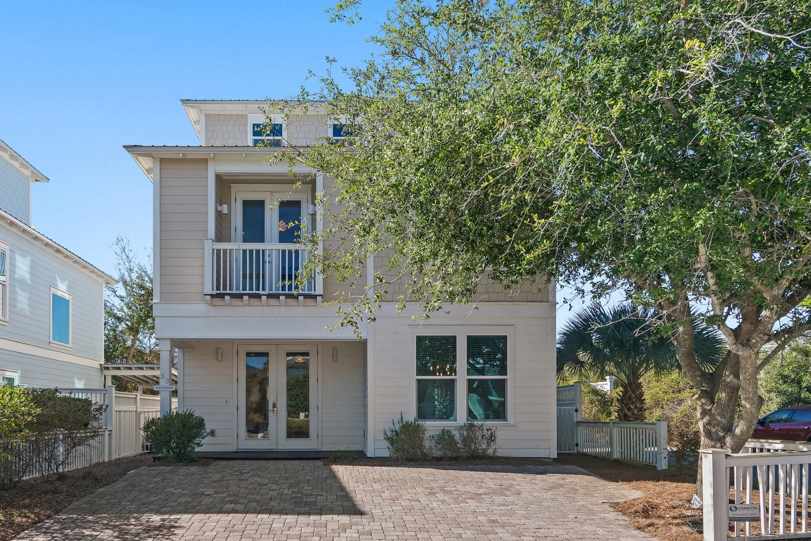 Ideally positioned in the heart of Seagrove, this charming coastal cottage offers an exceptional 30A lifestyle just four homes off scenic Highway 30A and only a short walk to the new public beach access located across from Café Thirty-A. With one of the most desirable locations along 30A, owners and guests will appreciate the convenience of easy beach access, nearby dining, shopping, and biking paths, all just steps away.
Designed for both relaxed coastal living and strong rental appeal, the home features an open-concept living, dining, and kitchen area that creates an inviting space for gathering and entertaining. The well-appointed kitchen includes a gas range, granite countertops, stainless steel appliances, and breakfast bar, seamlessly connecting to the dining area and spacious living room. The second floor serves as a private retreat with a primary suite and en-suite bath, along with a comfortable sitting area just outside the bedroom. This level also features a bunk room, a full bath and a full laundry room, making the layout ideal for maximizing rental occupancy and guest comfort.
The third level adds valuable flexibility with a large bonus room, additional sleeping accommodations, and a full bathperfect for hosting extended family or increasing rental capacity. Outdoor living is highlighted by the covered open-air deck, spacious enough for dining and entertaining.
Whether used as a second home or a fully rental-ready investment, this property combines a highly walkable Seagrove location, easy beach access, and a versatile floor plan designed to meet the needs of today's buyers and vacation renters alike.