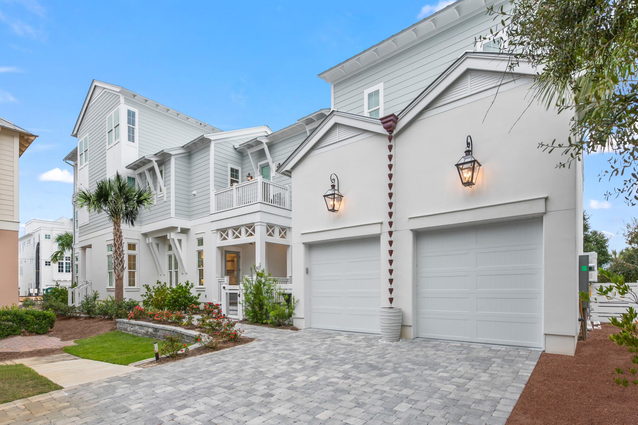 A coastal oasis, this spacious residence boasts a prime Inlet Beach location along 30A's coveted east end. The close proximity to both the beach and to bustling town centers is superb, with just a short stroll to the beach as well as the neighboring shopping and dining of both Rosemary Beach and 30Avenue. A testament to the coastal lifestyle, the spacious plan was designed with memorable beach gatherings in mind. With wood flooring throughout, a private heated pool, and a two-car garage, this five bedroom beach home appeals to a discriminating buyer. Upon entering the home, you will be greeted by a bright and open living area, centered around a gas fireplace that showcases a stunning shell stone finish. The living area seamlessly flows into a gourmet kitchen boasting a pecky cypress ceiling, quartz countertops, and top-of-the-line Thermador stainless steel appliances, including an icemaker and gas range. The oversized kitchen island provides a breakfast bar with seating for four that is perfect for casual meals. For a more formal dining experience, the adjacent dining area comfortably seats eight. Also on the first level is a junior primary suite, with large walk-in shower and double vanities. A convenient half bath off the mudroom gives easy access to the pool deck. Upstairs, the primary suite is a true retreat, with pecky cypress beams and a sitting area complete with a gas fireplace. Access a private balcony and a lavish primary bathroom with a large walk-in shower and soaking tub. The south-facing guest bedroom, with an ensuite bathroom, features a private balcony of its own, with impressive views of the Gulf. The second level offers yet another guest bedroom, with an ensuite bath, as well as a bunk room with four twin beds, ideal for accommodating your younger guests. A well-appointed guest bathroom includes double vanities and hallway access. A second spacious living and media area and a laundry room are both conveniently located here as well. Continue to the third level for a dedicated entertainment and relaxation space. An expansive game room provides ample space for leisure activities and movie nights are a breeze in the attached media room. The highlight of the third level is the expansive covered deck with spectacular views of the Gulf. Appointed with a summer kitchen complete with a gas grill, mini fridge, and sink, al fresco entertaining and breathtaking sunsets become a favorite pass time. A unique blend of luxury and comfortable coastal living, this is a true haven for those seeking the ultimate beachside retreat.