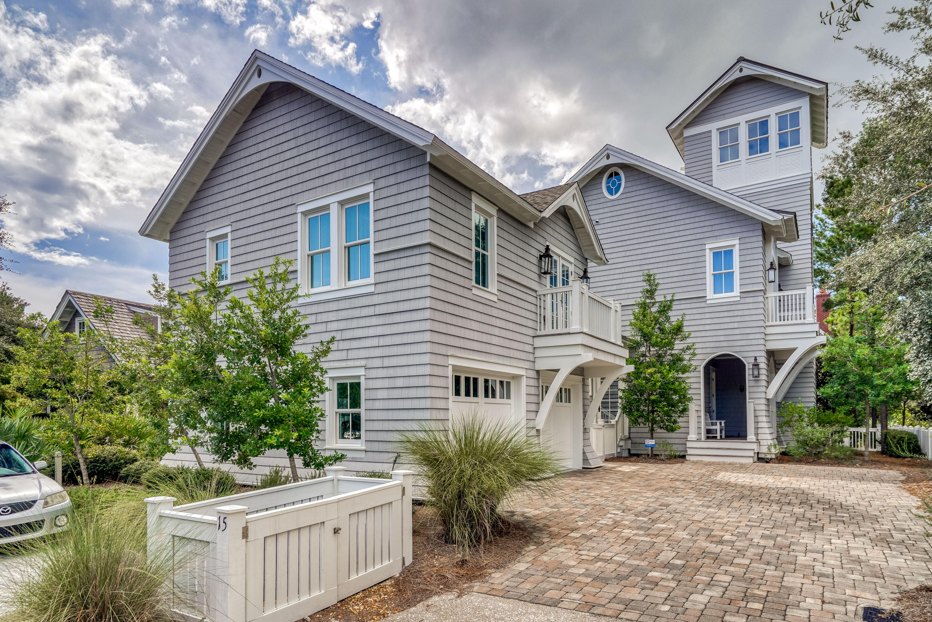 Crisp architectural lines and soothing neutrals create a peaceful coastal retreat at this 4BR/4BA/2 Half BA WaterSound Beach residence with a detached carriage home. A stunning collaboration between local experts Thurber Architecture PA, Dune Construction and Urban Grace Interiors, enjoy a central community location steps from the children's and dog park and only a short stroll or golf cart ride to the beach. Antique heart pine floors and shiplap walls are found throughout the home which features a reverse floor plan designed for gathering. The second level living and dining area are centered around a stately gas fireplace and feature vaulted shiplap ceilings. This light-filled space includes two sets of French doors that open to a spacious porch for extended living space. See ''More'' The gourmet kitchen features an expansive marble breakfast bar, a charming farmhouse sink, custom cabinetry and commercial grade appliances including a separate wine refrigerator. The primary master suite is also located on this level with a private balcony, vaulted ceilings, two walk-in closets and an exquisite ensuite with a separate soaking tub, dual vanities, and a large tiled walk-in shower. On the first level, find two beautiful guest suites, one serving as a secondary master with a morning bar. There is also a separate office with a built-in desk and custom barn doors. The third level includes a wet bar, additional storage, and a winding staircase that leads to an open-air tower with sweeping community views and a peek at the Gulf. Step outside to access the two-car garage with a separate staircase to the one-bedroom carriage home with living and dining area, efficiency kitchen and a private bath. This home is offered move-in or rental ready with all furnishings, a golf cart and two bicycles.

Both sophisticated and stylish, the gated WaterSound Beach community located south of Scenic Highway 30A offers homeowners a rare sense of seclusion with easy access to area activities. Amenities include swimming pools, a puttering park, community green spaces, a state-of-the-art fitness center and private boardwalks to one of the most beautiful mile stretches of coastline in the area.
