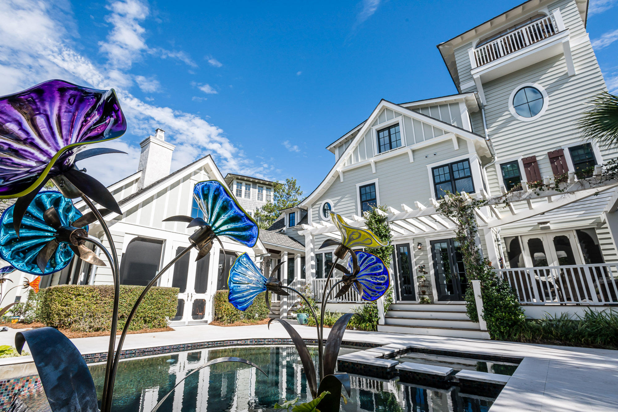 This home allows the near impossible, an estate type lot in WaterSound Beach. You can have a large private lot and still have all of the amenities found in WaterSound Beach. This home features forever gulf views and stunning views over Deer Lake State Park. The home was designed by TS Adams and built by Gulfview Construction. Home has never been rented. Featuring an incredible back yard complete with infinity swimming pool with whirlpool, sitting areas, a fully screened pool cabana , complete with grill, fireplace and outdoor heaters. Enter the home to a huge inviting great room with expansive fireplace and wet bar, opening to the gourmet kitchen and dining areas. There is also a fully screened dining porch that could be converted to a main floor master suite. This home is perfect for entertaining.  The professional chef's kitchen features all you would expect from a WaterSound Home, even including a Gaggenau Steamer in the island.  The home features a large two car detached garage with one of the largest driveways in WaterSound, allowing for parking ease.  The second level features the Master Bedroom suite complete with walk in closet and 5 piece master bath with steam shower.  There are three additional large bedrooms all en suite with the laundry room also on the 2nd floor, no need to haul laundry up and down stairs.  The amazing 3rd floor is large enough for bunks, or could be used as a game room.  Bright and sunny it also features gorgeous built in cabinets and provides an office for the most discerning executive.  There is also a large attic storage area.  Continue up the dramatic stairs to the open air 4th floor tower for dramatic gulf views and incredible sunsets.  This home represents the opportunity to have one of the most unique lots, with quality construction and wonderful views.  This home is a "must see" for anyone looking in WaterSound Beach!