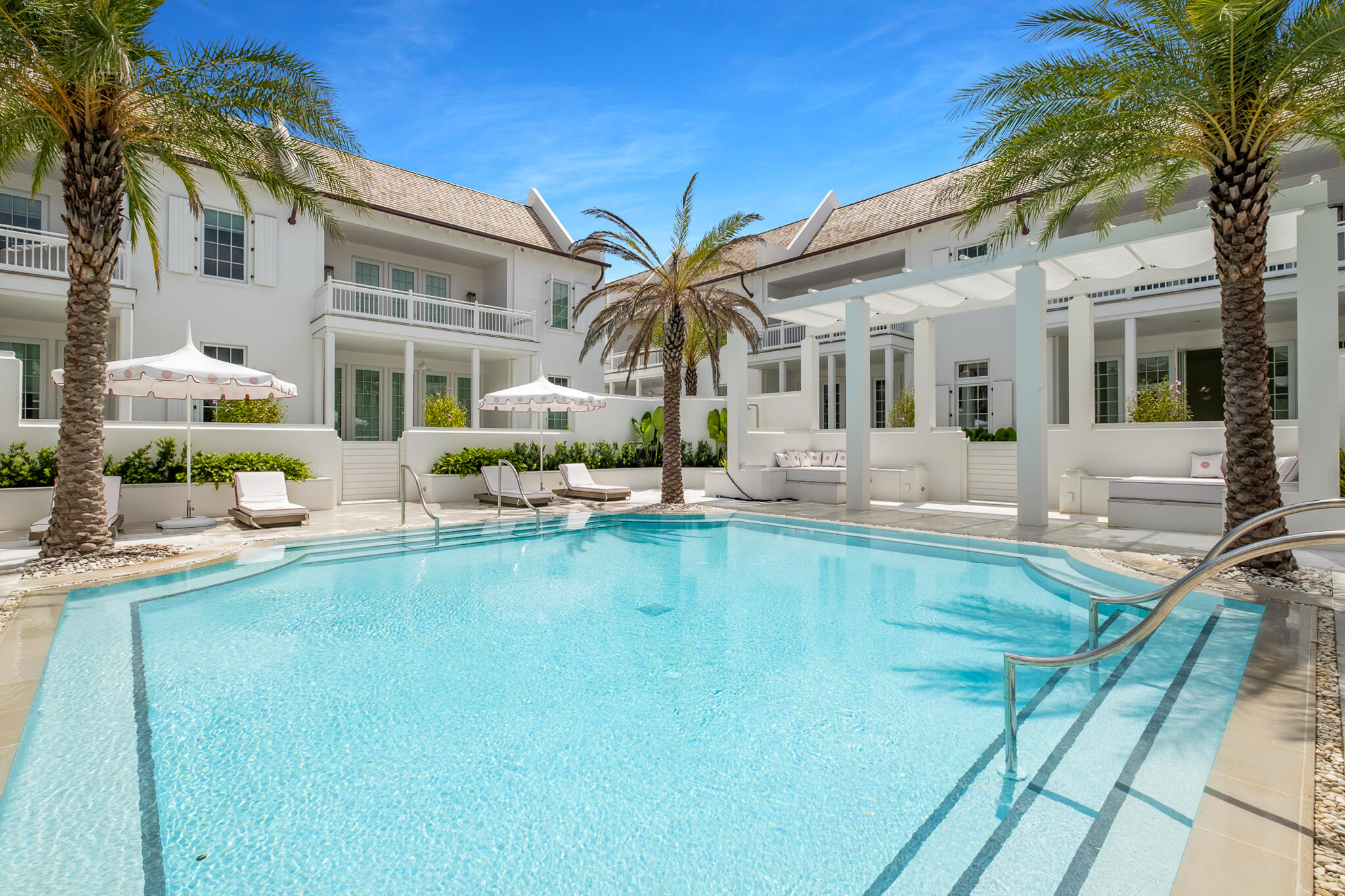 Exquisite 3 BD | 3.5 BA luxury townhome  located in the newest and most exclusive development on 30A, Kaiya Beach Resort, situated just west of Alys Beach and a resort unto itself. Designed by renowned Khoury Voigt architects and developed by Romair, no detail was overlooked in this amazing community with cobblestone streets and white Grecian stucco architecture. The fountains, lined by expansive Palm trees, greet you as you enter this tranquil community. The townhome itself offers almost 2,500 sq. ft of interior living space, 900 sq. ft of covered outdoor terraces, and an oversized 2 car garage. It's also an end unit located on a private, peaceful courtyard, which allows for an abundance of natural light. Designer upgrades in this townhome include: Bianca Carrera marble bathrooms, Caesarstone countertops in the kitchen, Subzero and Wolf appliances, Waterworks kitchen and bath plumbing fixtures, concrete pavers, and stained white oak flooring. The first floor is very open and spacious and includes a chef's kitchen, a beautiful center island with ample storage and a separate dining alcove. It expands into a luxurious feeling living space providing a relaxing retreat for residents and guests, who will also enjoy the exclusive use of the Mews pool and cabanas that are just steps off the front porch. The second level includes the expansive master suite that opens onto a private terrace overlooking the courtyard and pool. The second level also has two additional bedrooms, both with their own en suite bathrooms. Owners and guests will enjoy the private beach club and nearby Rosemary Beach with world class shopping, dining and entertainment. This luxury townhome is being sold fully furnished and ready for permanent living or vacation rentals.