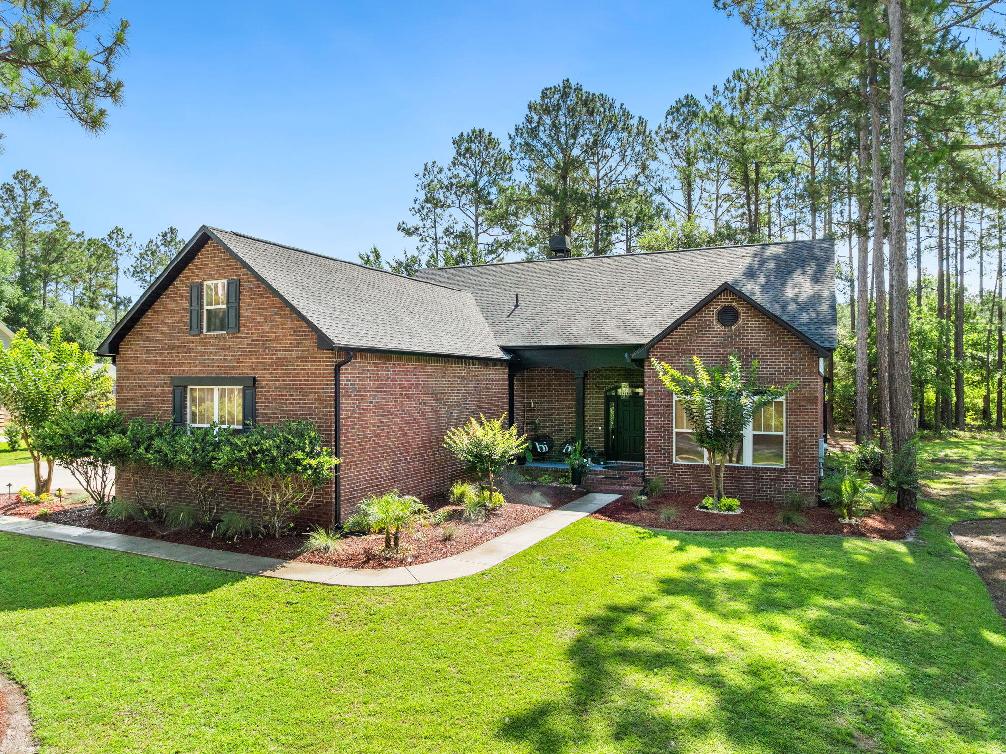 Accepting BACKUP Offers! 
Located within a gated golf course community in Freeport, this beautifully updated 4-bedroom, 3.5-bath home offers 3,377 square feet of spacious living on a landscaped half-acre lot with no neighbors directly in front or behind. The setting provides added privacy along with peaceful views of nature, a pond, and the surrounding golf course.
Inside, the main living area features soaring cathedral ceilings that create an open and inviting atmosphere, seamlessly connecting the living room, kitchen, and dining spaces. The kitchen offers ample counter space, double ovens, and a layout that flows naturally into a casual dining nook, ideal for everyday meals and gatherings.  A separate flex space near the entry provides versatility for a home office, formal dining area, or additional living space.

The primary suite is located on the main level and includes dual walk-in closets along with direct access to the screened lanai, creating a comfortable retreat with easy indoor and outdoor flow. Upstairs, a second living area offers additional space for guests, hobbies, or media, while a spacious en-suite bedroom adds flexibility for family or visitors.
Outdoor living centers around the screened lanai overlooking the private backyard, mature landscaping, a tranquil pond, and golf course views beyond. The peaceful setting makes the space ideal for relaxing or entertaining.
Additional features include a spacious three-car garage, recent updates throughout the home, and a new roof installed in 2024.
The gated community offers amenities such as a swimming pool, tennis and pickleball courts, a playground, and access to the golf course. The location is convenient to shopping and everyday necessities in Freeport, with the white sand beaches of South Walton less than 30 minutes away.