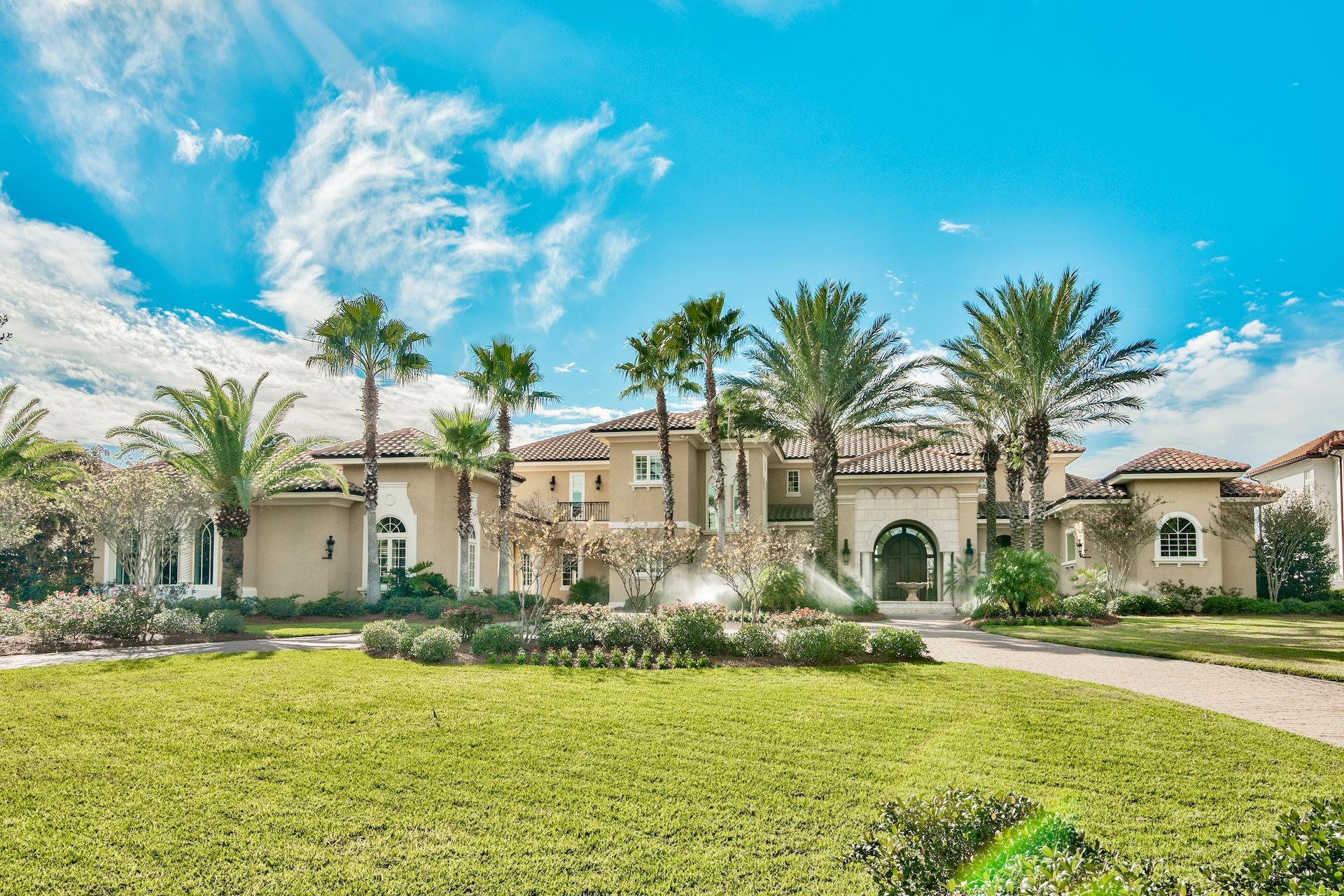Welcome to Waterford at Kelly Plantation, the exclusive gated waterfront enclave offering estate sized bay or bayou front homesites.
This gorgeous custom home is situated on deep water Jones Bayou and offering stunning open bay views as well. Constructed with the finest of materials, superior workmanship and an eye for detail. Great curb appeal, with a large circular brick paver driveway, center water feature fountain, porte cochere, motor court, an oversized two car garage and a separate oversized one car/golf cart garage. Gorgeous double entry doors open into a large foyer with soaring ceilings and the first of many water views. Directly off the foyer is the living room, with two story raised and coffered ceiling, French doors leading to the outdoor space, fireplace. Adjoining is the formal dining area, also with coffered ceiling and French doors leading to the outdoors space.  To the right off the foyer is a very handsome study with a fireplace, custom mantle, built-in bookcases and the entrance into the luxurious master wing. From the vestibule to the left is the waterfront master bedroom, generously sized with a cozy sitting area. In the vestibule are two large walk-in closets with custom built-ins. To the right is the spa-inspired master bath featuring his and hers private water closets,dual anities, oversized Jacuzzi tub, a huge walk-through shower with rain shower and dual shower heads.  The east side of the gallery opens into a large hallway with direct access to the porte cochere and garage, laundry center with abundant cabinetry and room for an additional refrigerator/freezer, elevator, climate controlled wine cellar, butler's pantry, powder bath and the true heart of the home...the gourmet kitchen, casual dining area and family room.  The kitchen has a huge granite breakfast bar, with handy storage cabinets underneath, a large center island, upgraded stainless appliances including a side by side refrigerator/freezer, refrigerator drawers, ice machine, glass backsplash, pot filler, walk-in pantry, custom cabinetry including pull out deep drawers and even a pull out spice rack at the cooktop.  The casual dining area has large windows overlooking the pool and bayou and the family room has sliding glass pocket doors set on a 45 degree angle that disappear and open onto the fabulous outdoor living space, complete with large covered patios, fireplace, summer kitchen with stainless grill, grill hood, refrigerator and sink, sparkling pool with kiddie area and spa. A separate guest house, currently used as a game room, has a large living area, kitchen with full sized refrigerator, dishwasher, copper sink and a bath with a large walk-in shower.  Back indoors in the main house....on the second level, accessible from stairway or elevator, are four ensuite bedrooms (one is currently used as a ladies office), a den/tv room with an adjoining morning kitchen/computer work station, a large walk-in storage room and several balconies overlooking the bay, bayou and pool.  Additional custom features include deep crown molding, recessed lighting, hardwood and travertine floors, central vac, surround sound and more.  Separate from the main house is the gym and an oversized one-car garage, large enough for golf cart and watercraft trailer.  Private dock on deep water with boat lift, slip and two personal watercraft lifts.  Beautifully appointed, meticulously maintained....this is a must see for the discriminating buyer.  As always, all dimension important to the buyer should be verified.