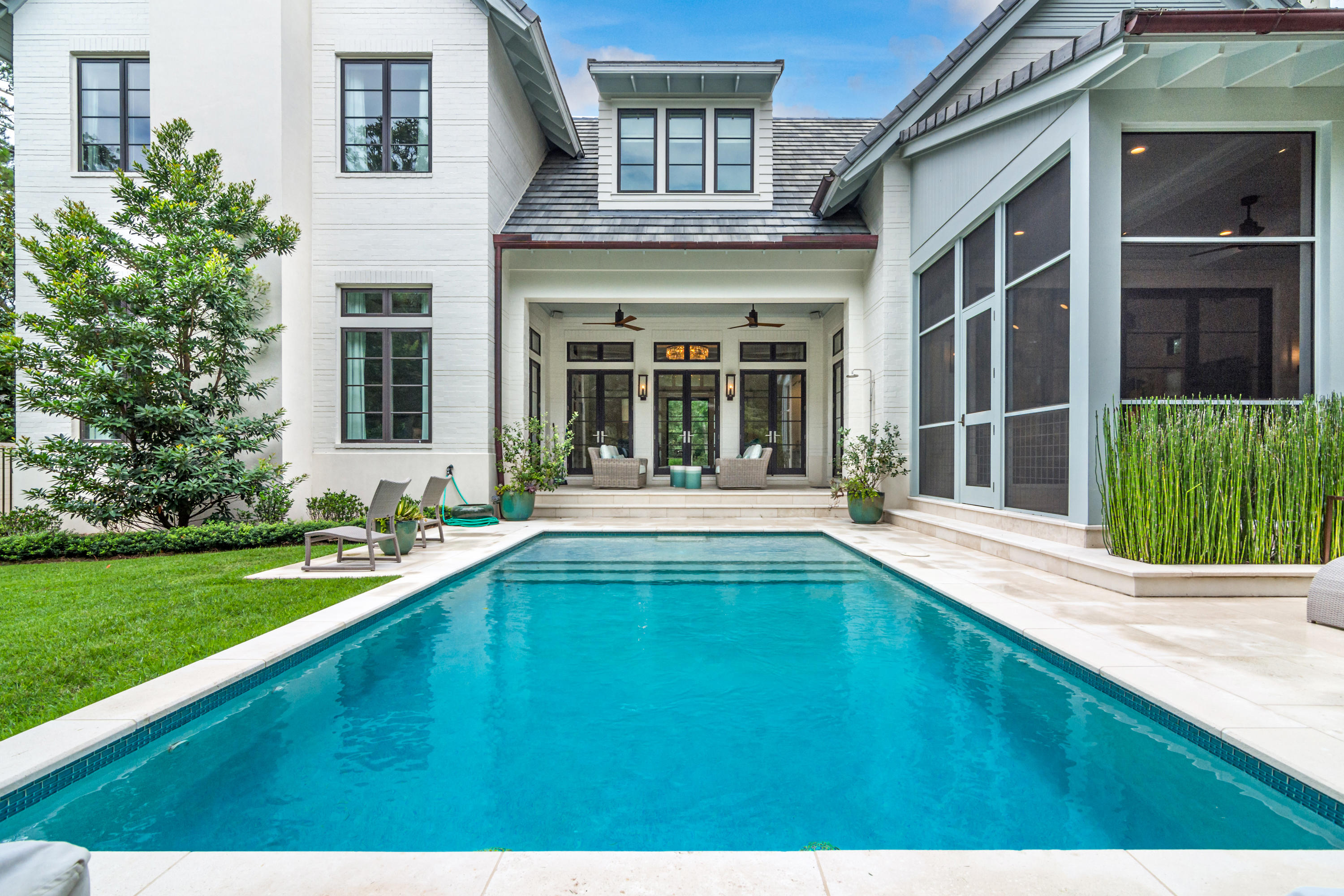 Meticulous attention to detail has been given to every aspect of this stunning 4 bedroom, 4.5 bathroom home in Burnt Pine. Designed by Geoff Chick & Associates and built by Chase Green Construction, this residence is truly one of a kind. An ideal floor plan creates a relaxed flow, while large windows and doors provide an abundance of natural light. On the first level, the great room opens to a well-appointed kitchen, complete with quartz countertops, and top of the line cabinets and appliances.  To the rear of the main living space is a 10 foot retracting glass door which open to a spacious screened porch and summer kitchen with best in class appliances.  A second outdoor living space, with retractable screen enclosure, also sits at the rear of the home and overlooks the home's private pool and fenced yard.  Also on the first level is a gorgeous entryway, library, master bedroom with bathroom and walk-in closet, mudroom, office, large laundry room, and powder room. The second level offers a sizable bonus living space, a huge bedroom (currently used as a gym) with full bathroom and additional storage, two guest bedrooms... each with its own bathroom, and an office.  Sandestin offers 4 Championship golf courses, a first class tennis center, full service marina with water sports, fitness center, gorgeous sugar white sand beaches, along with world class dining, shopping, and entertainment at the Village of Baytowne Wharf, Grand Boulevard at Sandestin, and The Market Shops.