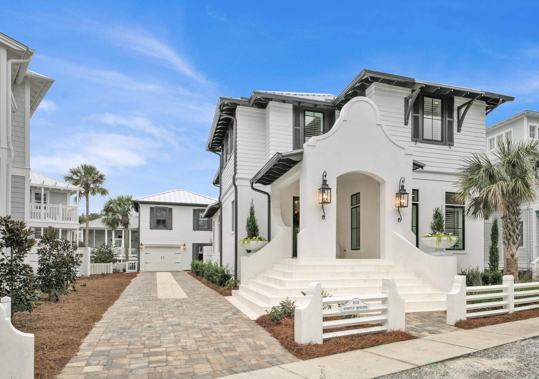 NEW! A rare find!---a brand new home, with striking curb appeal, completed in 2021,  and coupled with a remodeled pre-existing separate guest cottage/garage.  Without exaggeration, this beach home is the finest interior home offered on the open market in Carillon in several years.  AND it is situated a mere four homes from the beach walkover.  This stunning Carillon Beach home features a total of  6 BR (4 in main house) and 5 1/2 baths tastefully and functionally fashioned from 3700 SFT of H/C space.  Whether you are looking for a permanent home, second home or investment property, this part block/stucco beach home satisfies all your desires. The spacious open-concept great room/kitchen-dining area spills onto an equally grand outdoor entertainment area with grill and outdoor kitchen. The first floor offers one bedroom with ensuite. (now being used as office).  The second floor features an oversized master suite along with huge walk-in closet together with another large bedroom with ensuite as well as a bunk room with 4 built-in bunk beds.  The second level also includes a separate living/gathering area for tv viewing, games or just reading/relaxing.  Carillon Beach is a secluded, private, gated-community tucked away on the extreme easterly part of Bay County just adjacent to the Lake Powell bridge and the state park.  Carillon boasts over 3900 linear feet of never-crowded, just re-nourished sugary sand beach as well as three community pools, tennis courts, basketball court and children's playground area. The upscale shopping and restaurants of Rosemary Beach and 30AVENUE are but a 5 minute drive away. Carillon will never experience the heavy traffic associated with certain other high-end areas due to its being gated and buffered on the west by Lake Powell and the state park, allowing you to enjoy proximity to all of the many benefits of 30A with none of the burdens.  Golf carts and rentals are permitted in the community.  (See documents for short term rental projection).
