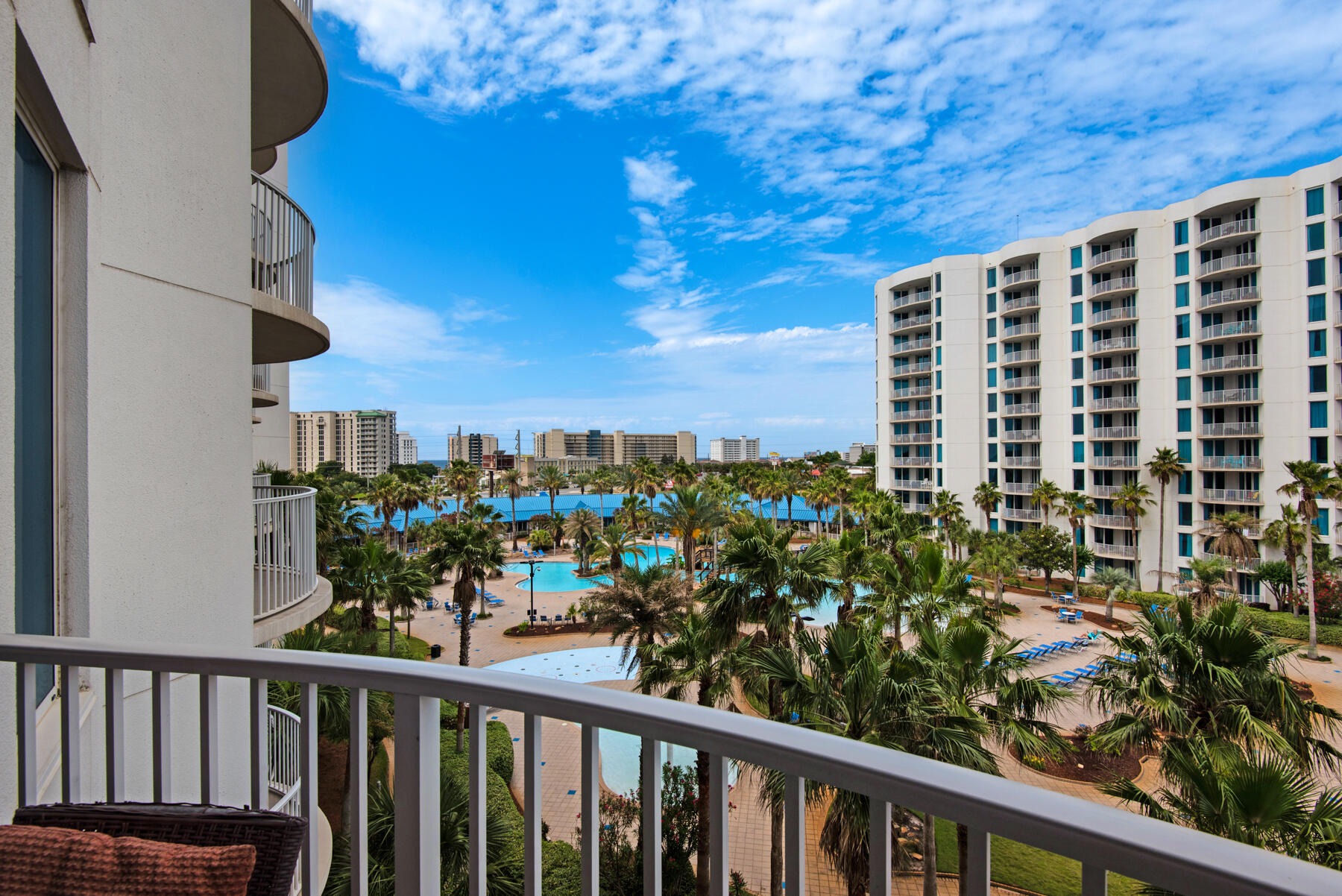 Motivated Seller!  Best priced unit with beautiful pool views from this two bedroom, two bath unit in Tower 1 at The Palms of Destin.  This resort features and onsite restaurant, a pool bar, hot tub, and a large resort style pool, as well as tennis, pickelball, basketball, and a childrens playground.  Located one block from the worlds most beautiful beaches, you and your guests will truly enjoy your time at this special resort.  New HVAC installed in 2022, and new sleeper sofa in the living room.  The master bedroom features a new mattress and has poolside views and the spacious living area is perfect for hanging out in the evening and catching movie or sunset.  Gated garage offers covered parking as well.  It's time to make this beauty your own.