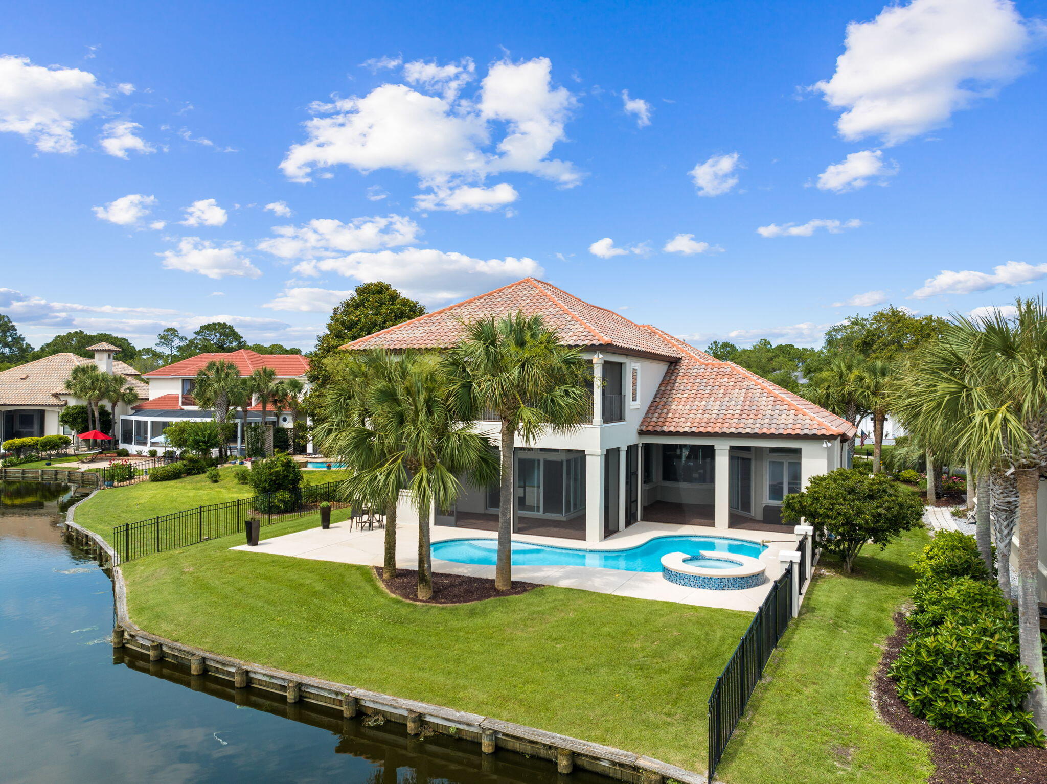 Welcome to 499 Regatta Bay Blvd, where modern elegance meets timeless charm. Nestled in the desirable Regatta Bay community, this meticulously remodeled home offers a perfect blend of sophistication and comfort with captivating sunsets sitting on one of the community lakes and the 16th hole tee box right across the water. Step inside this 5-bedroom 4 bath home to discover a seamless fusion of contemporary design and tasteful appeal. This home was completely remodeled in 2022 including a brand new whole home generator, new Rinnai hot water heater, Quartzite counters throughout, custom cabinets throughout, antique newel accent post from England on the stairs, pecky and sinker cypress accents, 150+ bottle wine room, whole home water filtration/softener system, reverse osmosis water system, new outdoor kitchen, pool resurfaced and retiled, new driveway for ample parking, walk-in attic storage, 3 car garage with 3rd bay climate controlled, and new AC installed in 2024. 
 
The gourmet professional grade kitchen is a chef's delight! Boasting top-of-the-line appliances, including a built in Miele coffee maker, integrated Bosch drawer microwave, 2 Miele dishwashers, and much more. 

Retreat to the serene master suite, complete with a spa-like ensuite bathroom and a pair of spacious walk-in closets for abundant storage. Additional bedrooms offer versatility and flexibility to accommodate your lifestyle needs.

Outside, the beautifully landscaped yard provides a peaceful oasis for relaxation and enjoyment. Great for hosting with the outdoor kitchen and spacious enclosed patio or just unwind after a long day with the breathtaking sunsets this home captures. 

Convenient proximity to the beach, shopping, dining, and entertainment options, this home offers the perfect combination of luxury and convenience within the esteemed Regatta Bay golfing community. Don't miss your chance to make this exquisite property your own. Schedule your private showing today!