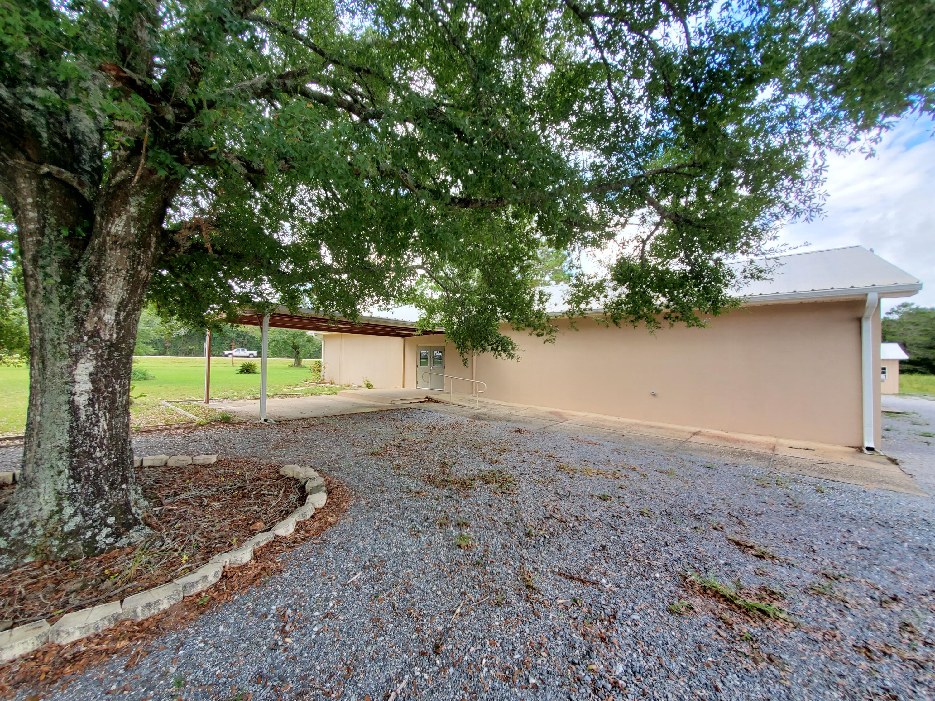 Excellent commercial opportunity along Hwy 90 just on the west edge of Defuniak Springs. As a former VFW Hall this 4,000 sf building is perfect for a showroom, banquet hall, symposiums, expositions, congregations, meetings and other gallery uses.