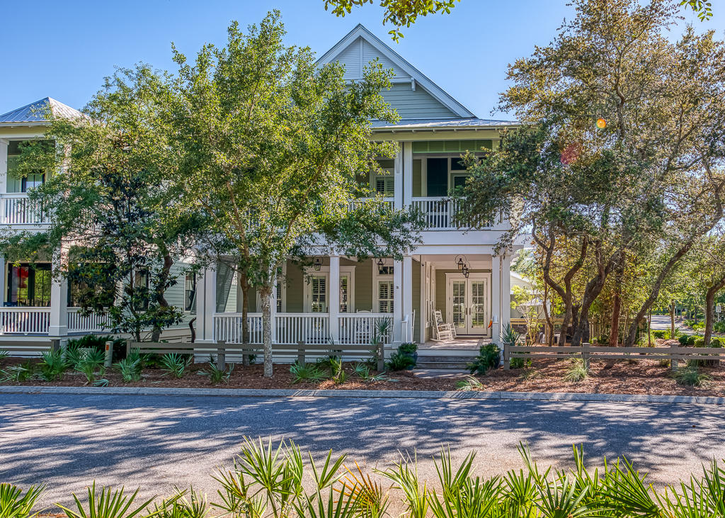 This gorgeous, never-rented beach house sits majestically on an oversized corner lot in Phase III of WaterColor exuding elegance in both form and function. Masterfully designed by Chris Stoyles and expertly built by the team at CORE Construction, the expansive floor plan and detail-oriented finishes provide nuances rarely seen in coastal-infused properties in this popular community. The exposed brick entry and hand-hewn repurposed beams add natural contrast to the crisp and contemporary shiplap walls throughout the lower level of the home. New renovations have brought in a fresh backsplash and hand-selected granite countertops to the entire state-of-the-art gourmet chef's kitchen, outfitted with a 48-inch Thermador range with double ovens and an oversized center island and breakfast bar... ...with peninsula display cabinets. The tranquil private outdoor space is well manicured and enchanting, offering a covered grilling station outfitted with a Big Green Egg and plentiful space for year-round alfresco entertaining on the custom brick paver patio around the shaded and heated pool. 

Upgraded ceiling fans on the screened porch and the Sonos surround sound system inside and out are an added bonus when enjoying the company of guests or simply taking in the allure of this exemplary residence. The large closets and oversized rooms make this home ideal for both a permanent residence or second home. Brand new plantation shutters have been installed throughout the entire interior, including the attached carriage house which comes complete with its own full kitchen, new HVAC and private access from the exterior. 

The included eco-friendly golf cart comes with brand new batteries and has its own space to park in the attached two-and-a-half-car garage, making travel throughout the neighborhood convenient when visiting the newly-constructed Beach Club, renovated Camp WaterColor, the tennis and pickleball courts or the community hiking and biking trails. Kayak and paddleboard access is available just a few steps away at The Boathouse for those who want to enjoy outdoor activities in the sunshine on Western Lake, one of the largest and most serene of the rare coastal dune lakes found along 30A.