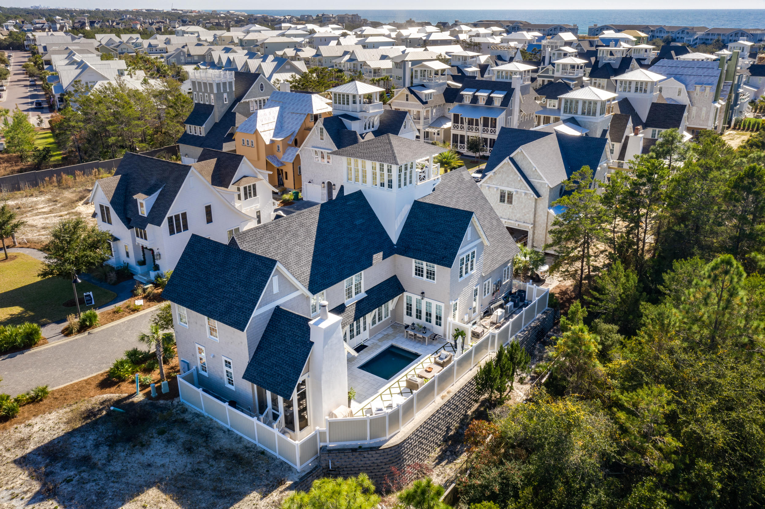 This exquisite home is located behind one of 30A's most exclusive gated boutique beach communities, Grace Point.  The home backs up to a very private wooded area and has a luxury private heated, saltwater pool with fountains and color lighting to create a outdoor resort experience.  There is a gate with code access directly from neighborhood into Watersound Beach Club so you really do have it all here. 

As you enter this stunning three story home you will be welcomed by eloquent craftsmenship with unique luxurious finishes.  The open living area on the main floor allows family and guests to share the living, dining and kitchen area for relaxing, cooking and dining together.  The rooms are light and bright which creates an upscale beach feel that 30A is known for. The upgraded kitchen has the finest amenities including walk-In, wet bar with sub-zero ice maker and 100 bottle, Sub-Zero dual Zone, wine refrigerator as well as Sub-Zero/Wolf kitchen appliance package.  The main floor also offers one of two master suites which makes it most accommodating as it also opens out into the courtyard pool space. The second floor offers the second master suite with three guest bedrooms, each with private bath and walk in closet as well as a second living space.  The top floor has an amazing view of Gulf of Mexico and Coastal lake from the covered Crows Nest with room for outdoor furniture as well.  The third floor landing could be used as an office, bunk room or entertainment room.  

A few other luxury amenities included are Culligan Water Filtration System throughout, Control4 Audio/Visual System inside and outside, coffee bar area with wet bar and Sub-Zero refrigerator for master bedroom, extensive custom drawers, cabinets and window seating with storage underneath throughout home, Generac automatic gas generator, enclosed steam shower in master, fire protection sprinkler system throughout home, Rinnai tankless water heating system, Hardwood Flooring from Burchette and Burchette throughout and last but definitely not least an interior design plan by Tracery Interiors.  

Lifestyle Membership to The Clubs by JOE are available to Grace Point owners. Includes access to WaterSound Beach Club, Shark's Tooth Golf Club and Camp Creek Golf Club.  This is a home you can't miss!