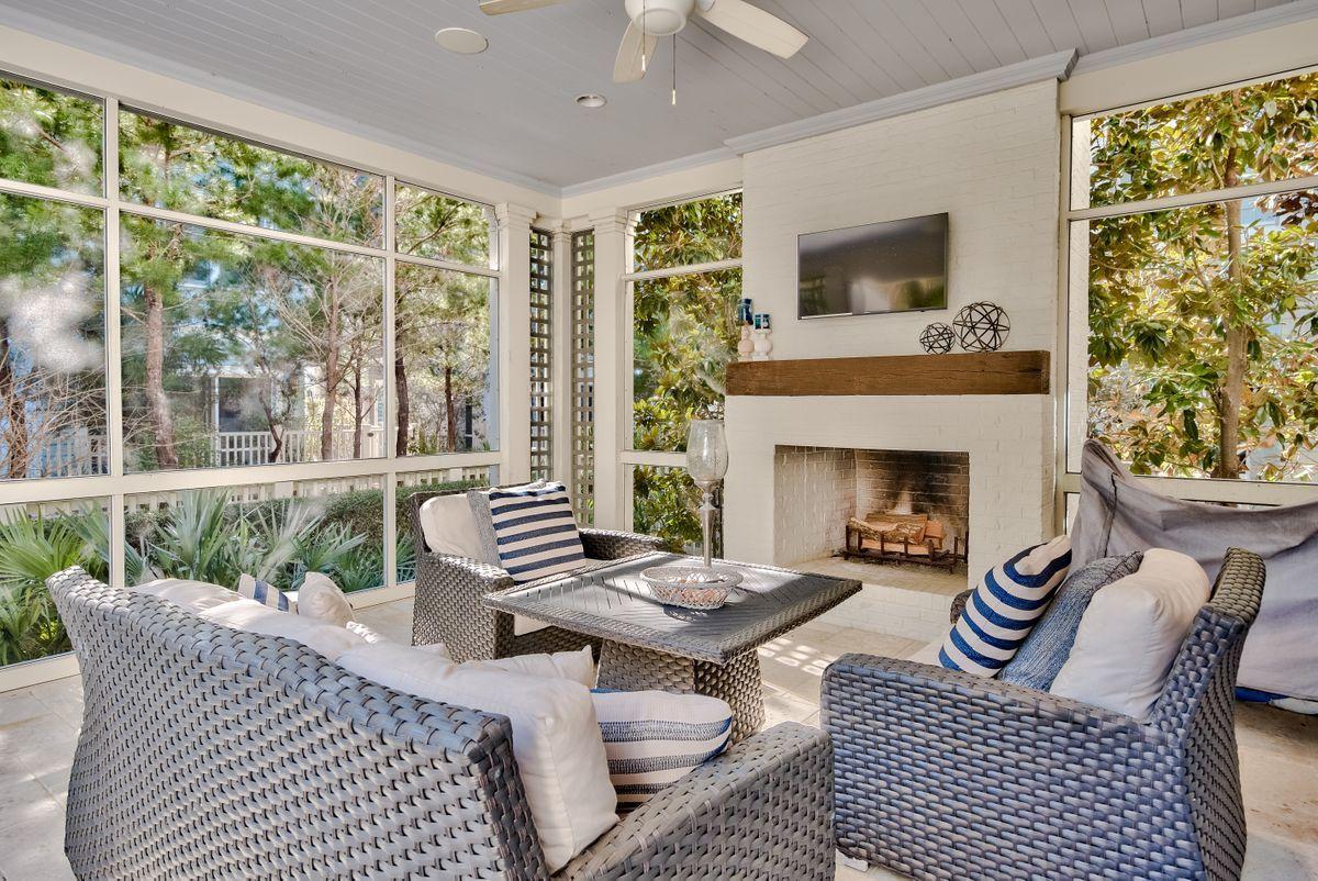 Located in prestigious WaterSound, this high-end home exemplifies coastal living at its finest. TS Adams Architecture collaborated with Gulfview Construction to create a bespoke home that boasts an extraordinary finish throughout with exceptional attention to detail. Check out the Venetian plaster walls and ceilings accentuated by reclaimed wood beams and appreciate the use of natural daylight through transom window above the doors. Custom stone flooring in the main living areas gives way to reclaimed light oak hardwood in the bedrooms. The generous sitting area room is accentuated by a custom fireplace which adds a focal point to this welcoming space. Peek over the half-height wall that separates the kitchen from the formal dining and living area and see what's cooking. Pancake breakfasts, sunset cocktails and canapes can all be served at the marble-topped island which easily seats four. The surrounding gourmet kitchen is a chef's delight with a nice balance of practical storage and elegant display cabinets. French doors lead directly outside and provide a welcome breeze. There's a useful junior master suite for guests on the main floor. The ensuite bathroom includes a freestanding tub for deep bubbly soaks and a double vanity inset into the marble countertop. A custom iron staircase leads up to further bedrooms, each with their own features. The second master is a peaceful retreat with its own sitting area. The outdoor living space is an impeccable private retreat with heated pool and half bath. The screened porch has its own cozy brick fireplace and bi-fold screen doors opening directly onto the deck. It's a beautifully designed area for relaxing and entertaining. Enjoy Watersound Beach fitness center with sauna, one full mile of pristine beaches, dog park, newly updated Childrens Park, Puttering Park, Linear Park and seven miles of boardwalks and walking paths. Camp Creek Lake is the place for kayaking and stand-up paddle boarding while sunsets on WaterSound Beach provide the perfect end to each day.