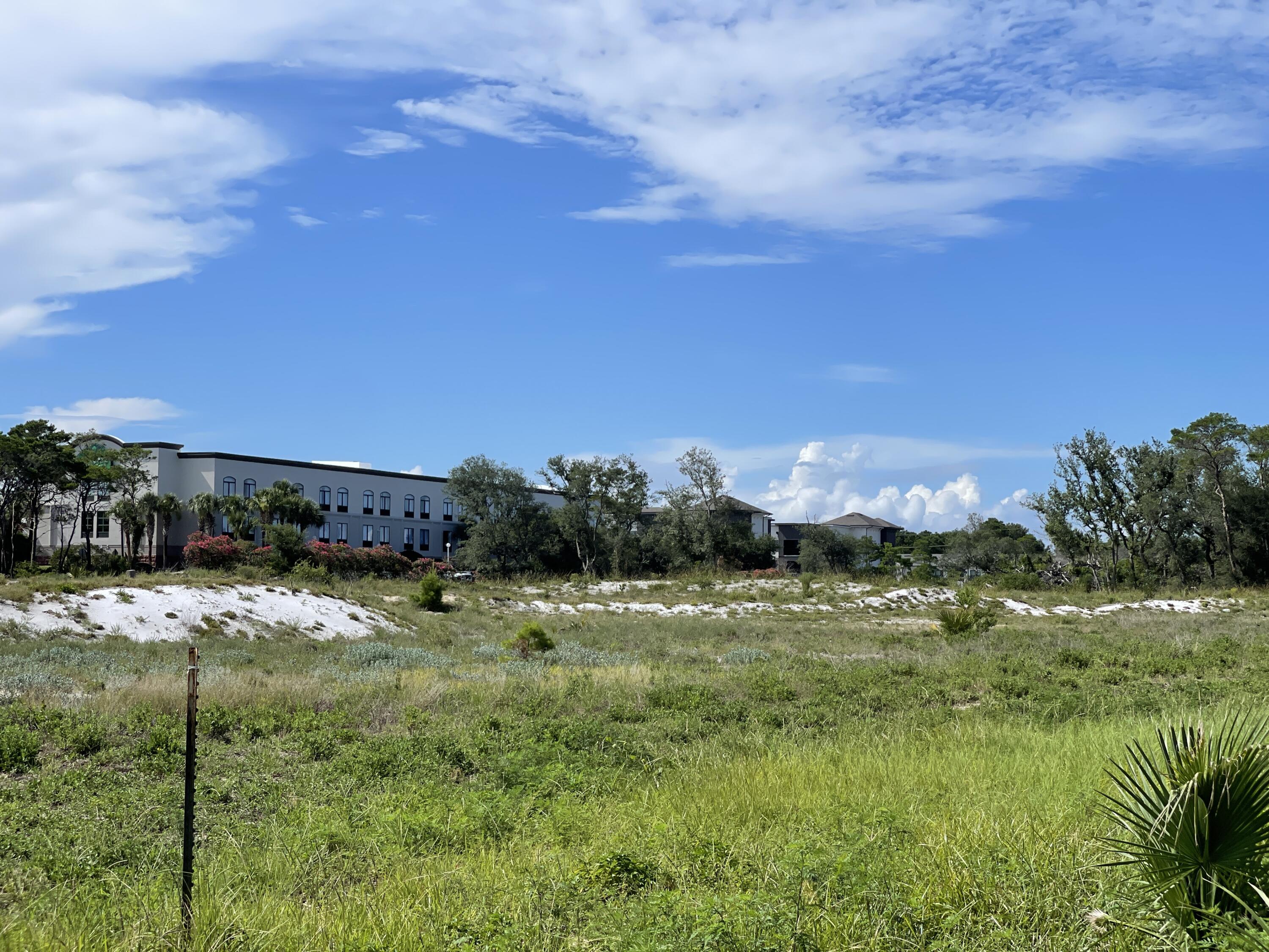 One of the very last, large, undeveloped tracts of land on Hwy 98 in the heart of Destin. This relatively level & cleared 10.25 +/- acreage is located on the North side of Hwy. 98 adjacent to the Big Kahuna Water Park on the East side.  The Gulf of Mexico is to the South, around amusement parks, entertainment, shopping. restaurants, fishing, and gulf front residential. The parcel is zoned Town Center Mixed Use, Commercial. Perfect for one  large or multiple hotels, apartments (with 20% commercial non residential square footage), mixed use, retail, health care development and much more. Seller requires a short due diligence period. Initial EMD $250,000.  Proof of funds or pre approval letter required with contract.
Buyer to confirm all information.
