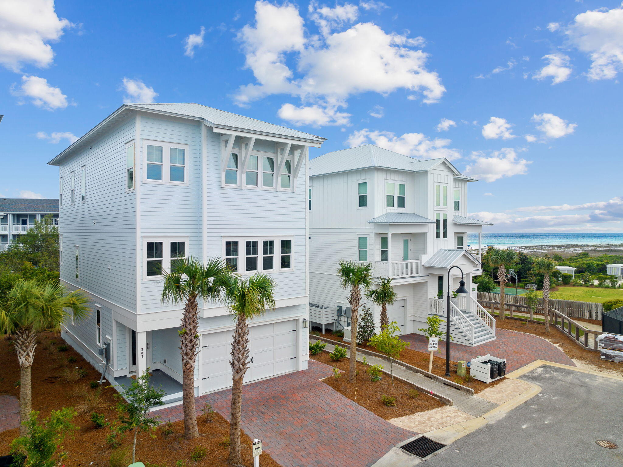 Welcome to 203 Siasconset Ln, a stunning brand new three-story beach home located in Prominence along Scenic 30A between WaterColor and Alys Beach, just steps away from the WaterSound Beach access gate. This turnkey vacation house features luxury finishes and professionally decorated furnishings with crisp white interiors. The 'Bora Bora' floor plan includes 4 bedrooms, 3.5 bathrooms, 3,550 SqFt of living space, an elevator, and decks/patios with amazing gulf views. Other features include hardwood floors, 10 ft ceilings, crown molding, shiplap accents, and a bunk room. The sleek chef's kitchen includes stainless steel appliances and expansive cabinetry. Seller to offer up to $50,000 credit for WaterSound Beach Club membership.  This is a must see if you are interested in WaterSound Beach Owners of this property will enjoy access to many neighborhood amenities within Prominence, including two resort-style pools, a fitness center, and a seasonal private shuttle service to the beach. The property is also conveniently located near 'The Hub', also known as the 'Big Chill', which features restaurants, shops, an amphitheater with a covered event pavilion, a cinema screen for movies and sports, and a stage for concerts and events.