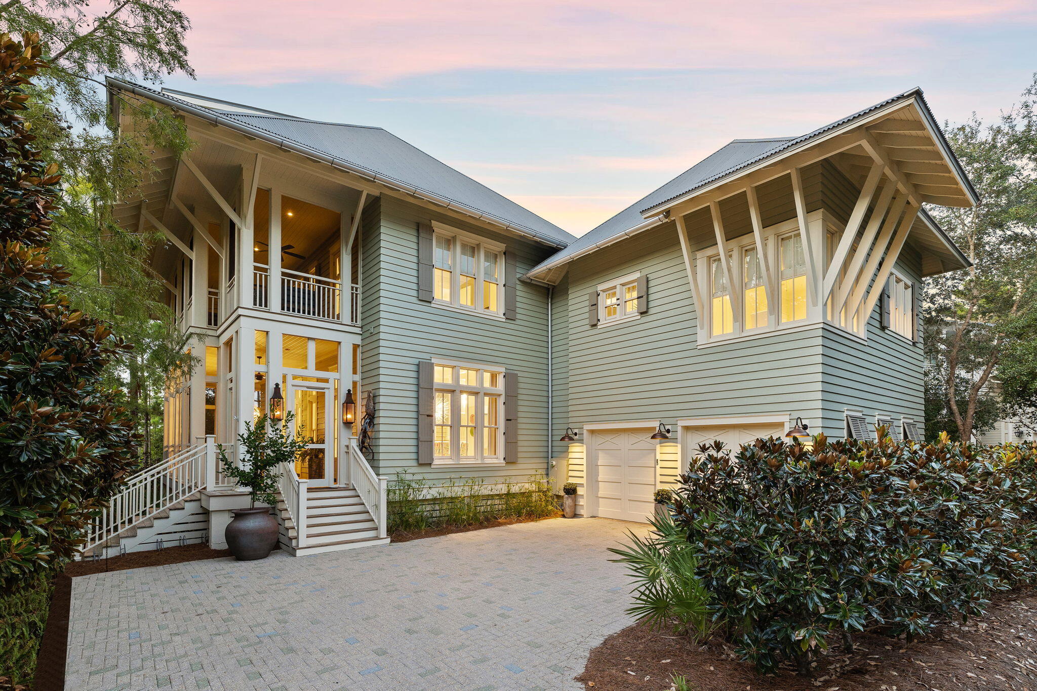 Nestled among nature, on a prime site directly overlooking the lake within the coveted Phase 1 Park District of Watercolor, Florida. This large residence stands as the embodiment of the coastal dune lake lifestyle, touting the ultimate in outdoor living with multiple deep porches, rare in their substantial size. The spacious 8-bedroom home, crafted under the expert guidance of a renowned team in architect Tom Christ and builder Mark Breaux, received a recent extensive remodel and also has gorgeous new interior appointments by Tracery Interiors. Discover an iconic legacy beach home positioned on a prime lot on the foothills of this community's crown jewel, Western Lake, with access to the community dock at your doorstep. Fronting Western Lake offers a highly sought-after location within the famed planned community. Upon entering, from an expansive, screened covered porch with dining table, lounge area and grill deck, guests are greeted with breathtaking vistas of Western Lake. Step inside this bright and uplifting beach house, with an open plan for the first floor kitchen, dining and living areas. Charmingly flanked by French doors that welcome in ample light and open to the huge screened porch that extends the full length of the west side of the home, lending outdoor dining and living spaces as well as direct access to stroll to the community walkover on Western Lake. This residence thoughtfully marries the indoors with the out, allowing you to embrace what truly defines Watercolor's coastal lifestyle. The broad living room, where 12-foot ceilings flaunt an airy and inviting atmosphere, frames scenic lake views with natural light flooding in.  The custom chef's kitchen with expansive island is a hub for family gatherings and entertaining, adorned with custom cabinetry, exquisite designer lighting and plumbing fixtures, Viking appliances and pristine quartz countertops. The main level showcases a private primary suite with stunning lake views, a sanctuary of comfort and serenity, that envelopes a large custom bathroom with freestanding tub, quartz counters and walk-in shower. stunning lake views, as well as his and her closets and a spacious sitting room that privately accesses the tranquil lakefront deck. A laundry room on the main level is conveniently tucked away, with ample counter space, cabinetry and sink, as well as a half-bathroom and garage access.

Ascend the staircase to the second level guest quarters, a haven of comfort and elegance. A spacious second primary suite opens to a private sitting room that accesses a second-story lakefront screened porch. This level unfolds to five more guest bedroom suites, two of which also offer direct access to the screened porch, as well as two additional laundry spaces. The attached carriage house, above the garage, is a splendid touch with its direct access from the main house. The carriage house presents a generous space, complete with its own living room, kitchen area and bedroom, a charming and inviting oasis where guests can make themselves at home and have an added layer of privacy. Climb to the third level to find an impressive ample space that serves as additional guest quarters, complete with a living/media room, a full bathroom, and an additional bedroom.

Escape to Watercolor, a coastal community that is a testament to thoughtful new urban planning, boasting an intricate network of trails, bridges, walkways and parks that seamlessly blend natural beauty, convenience and a vibrant sense of community, while also enjoying the sugary white sands and crystal clear waters of the Gulf. Enjoy the unmatched convenience of a prime Phase 1 location, tucked in nature on the lake while just a short stroll to The Beach Club and a wealth of unmatched, exclusive community amenities, including the numerous boutiques and dining options of neighboring Town Center and the water activities at a The Boat House, Marina Park, the Amphitheater and award-winning tennis and pickleball courts. A residence designed to experience the luxury of true coastal living along Scenic Highway 30A.